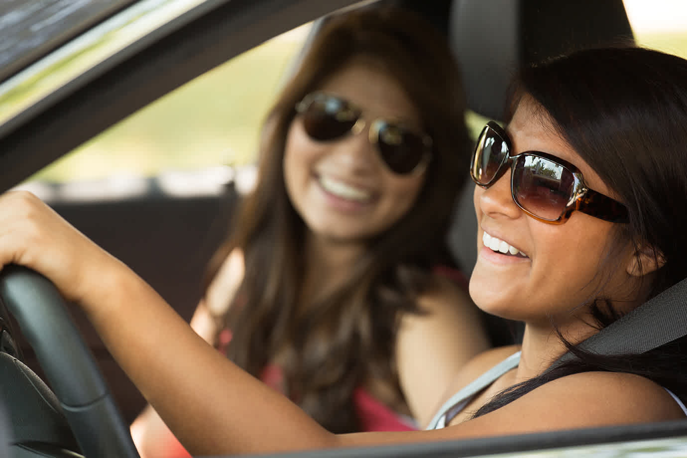 women driving car