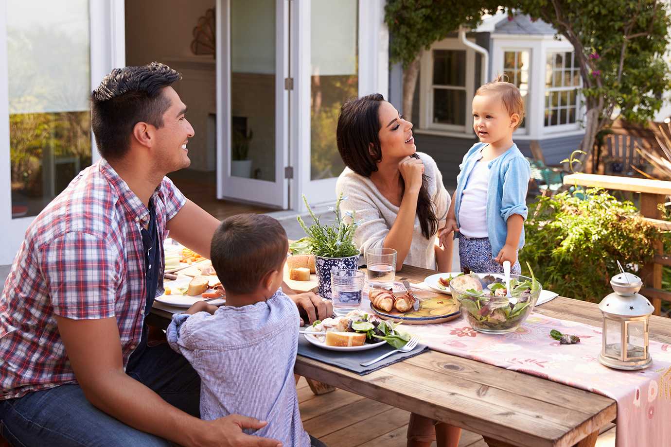 Family eating outside on patio