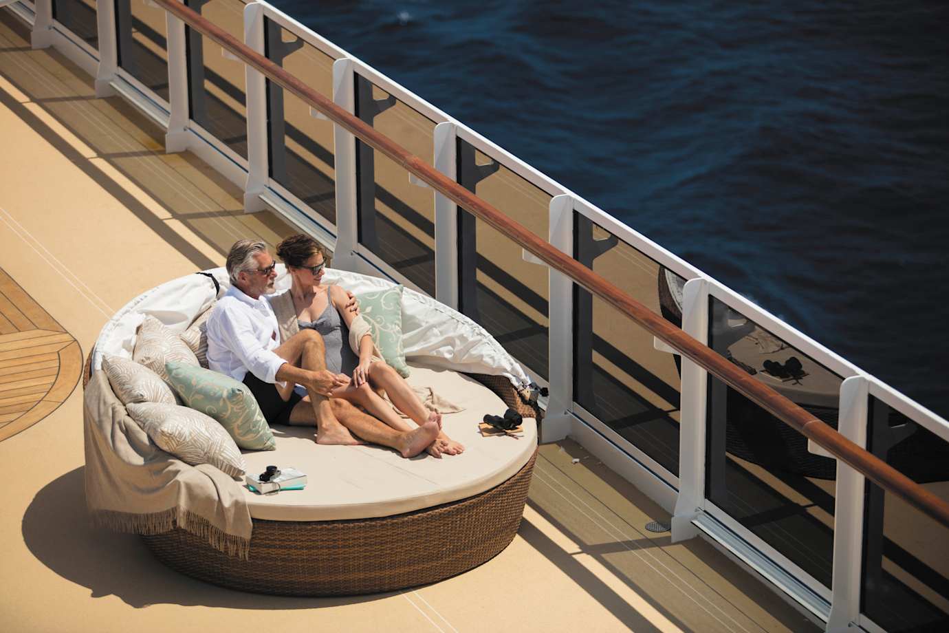 couple on pool deck on regent ship