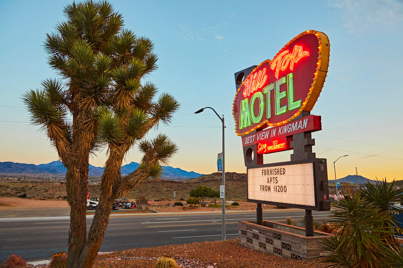 Hill Tops Motel neon sign at dusk in Kingman, Arizona, on Route 66.