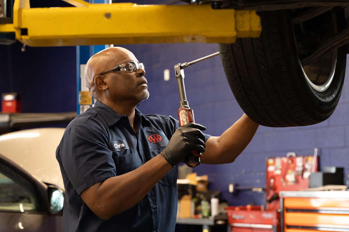 Technician performing tire repair service