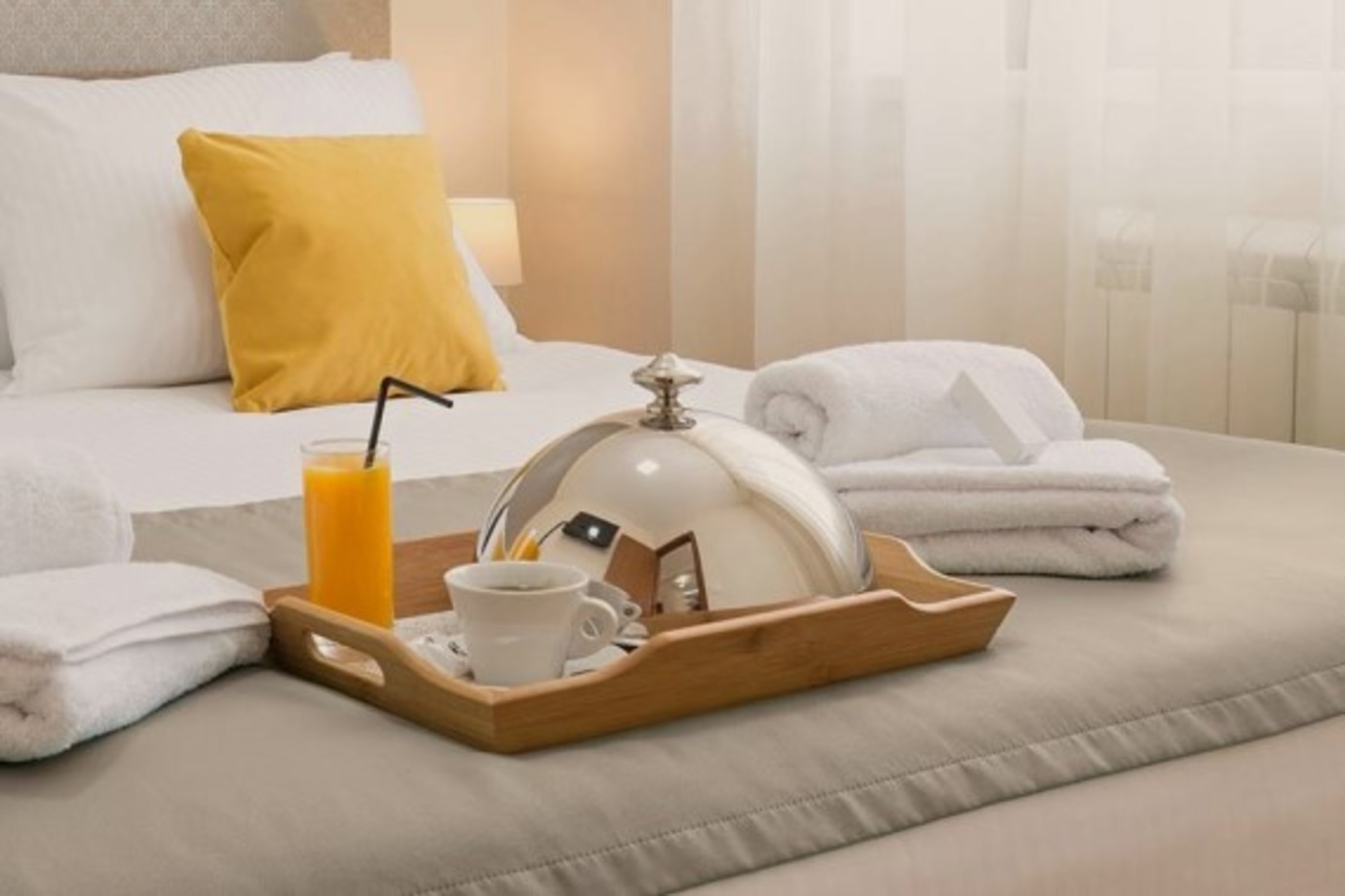 Hotel bed with breakfast tray