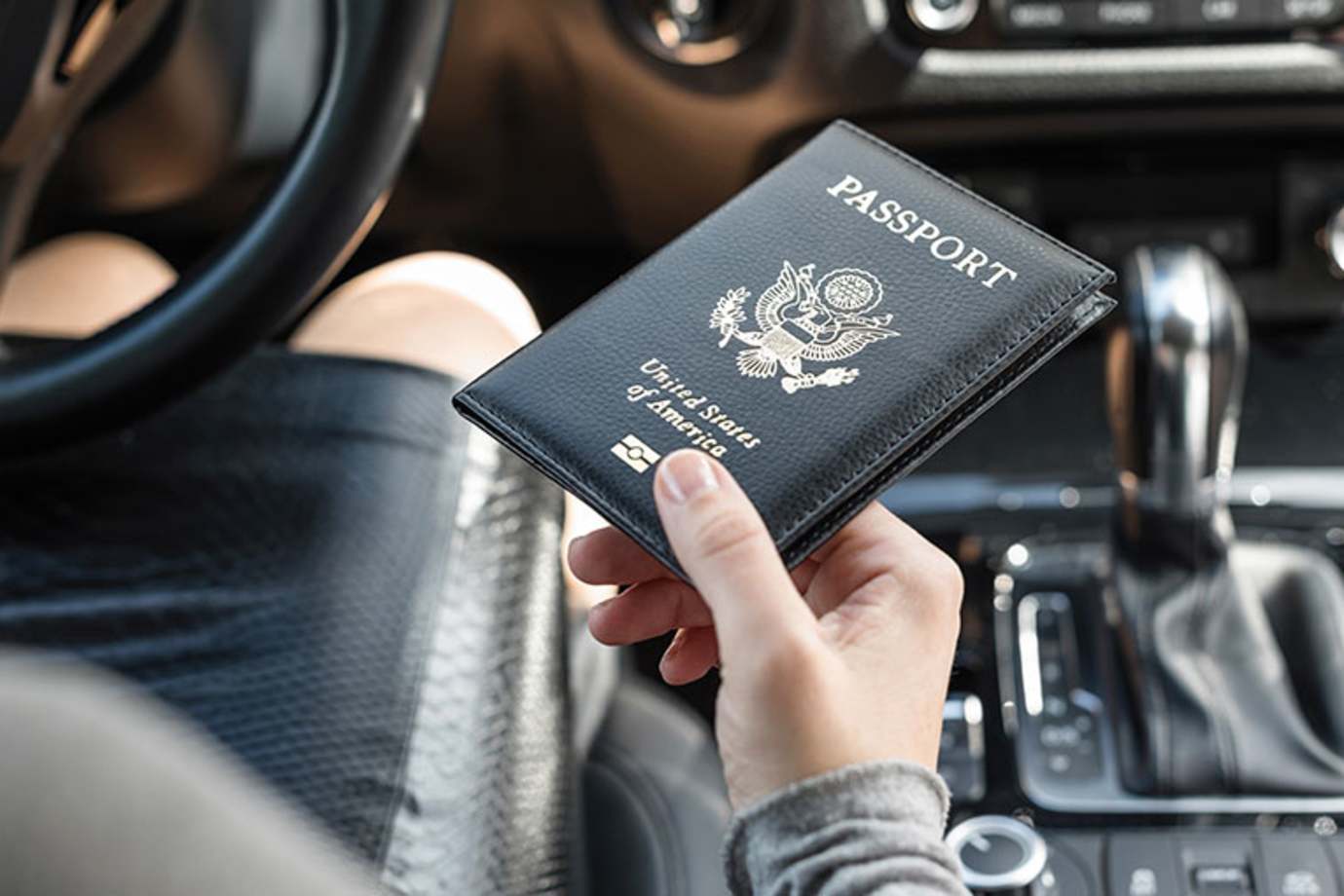 a woman with AAA Mexico driving insurancecrossing the Mexico border with her U.S. passport
