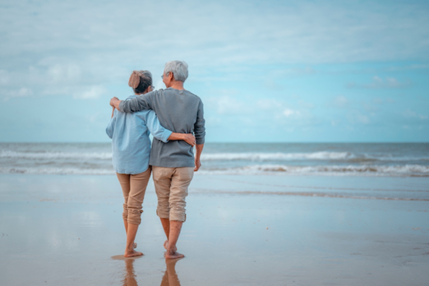 AAA Members with AAA Life Insurance walking on the beach