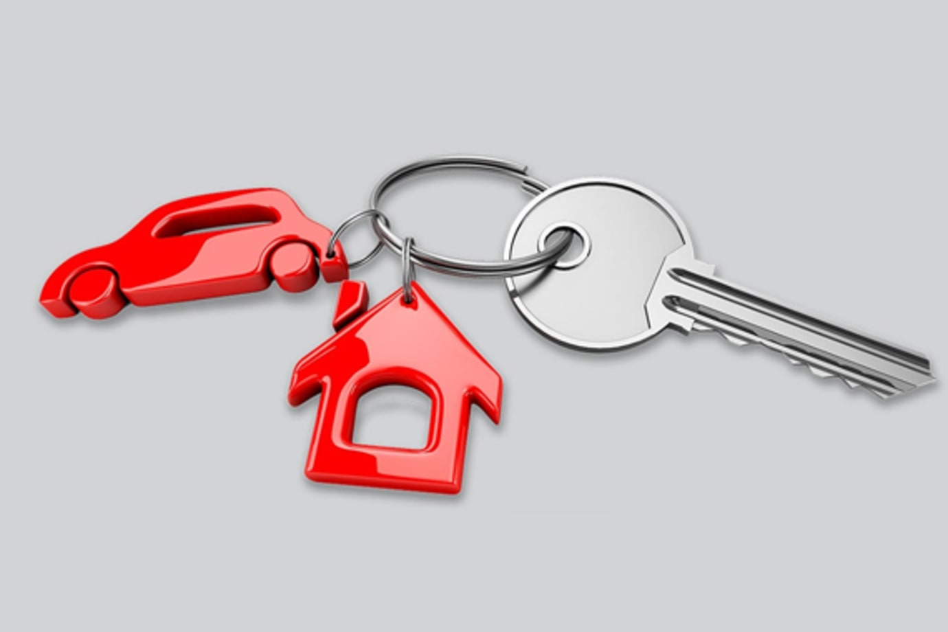 keychain in the shape of a house and a car with keys attached