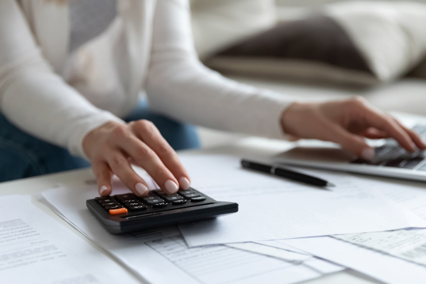 A woman calculates her income taxes.