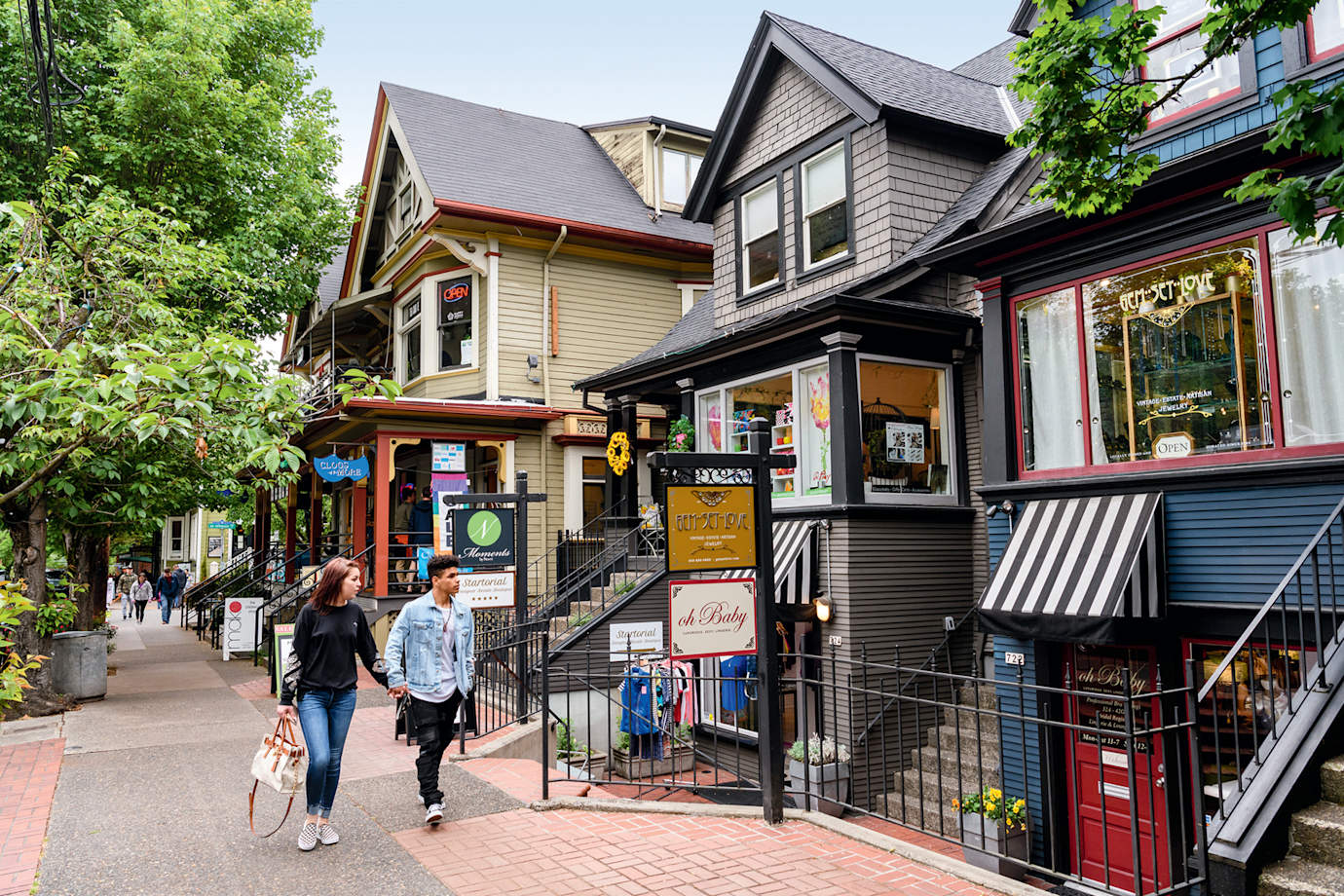 Window-shopping couple strolls along NW 23rd Avenue in Portland, Oregon.
