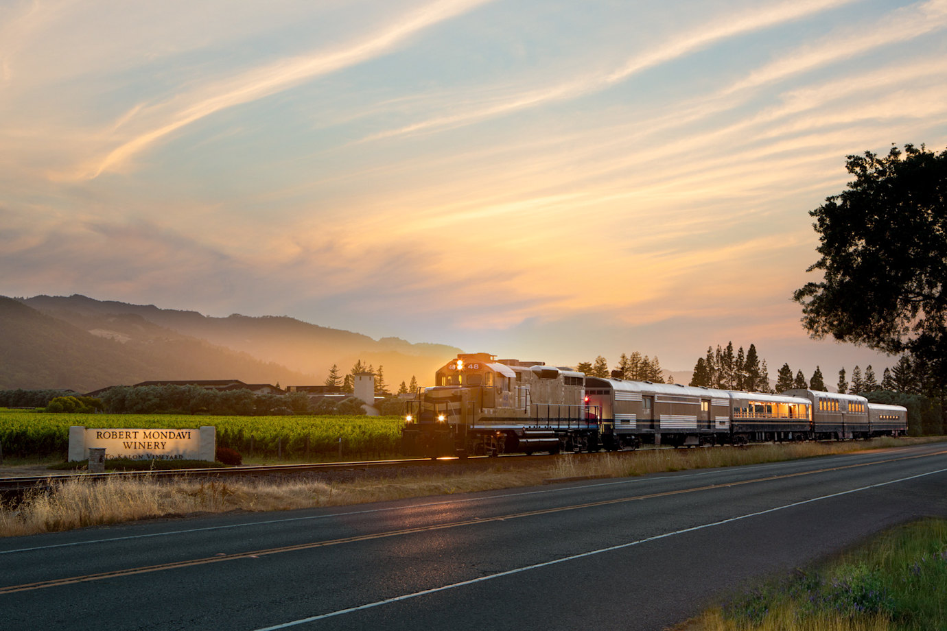 The Wine Train passes the Robert Mondavi Winery's To Kalon vineyard during late afternoon in Oakville, California.
