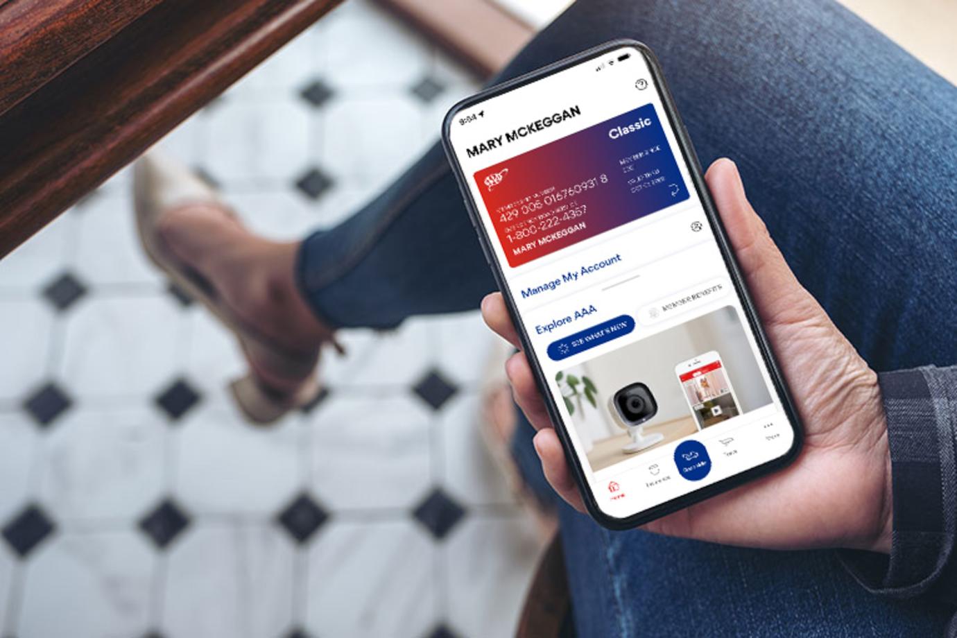 A AAA Member accesses their account through the AAA Mobile App on their smartphone.
