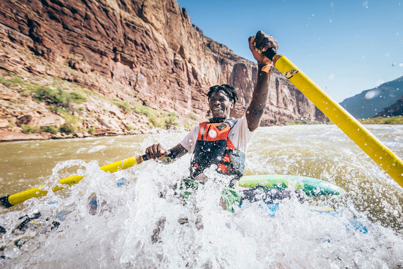 A person rafts down the Colorado River.