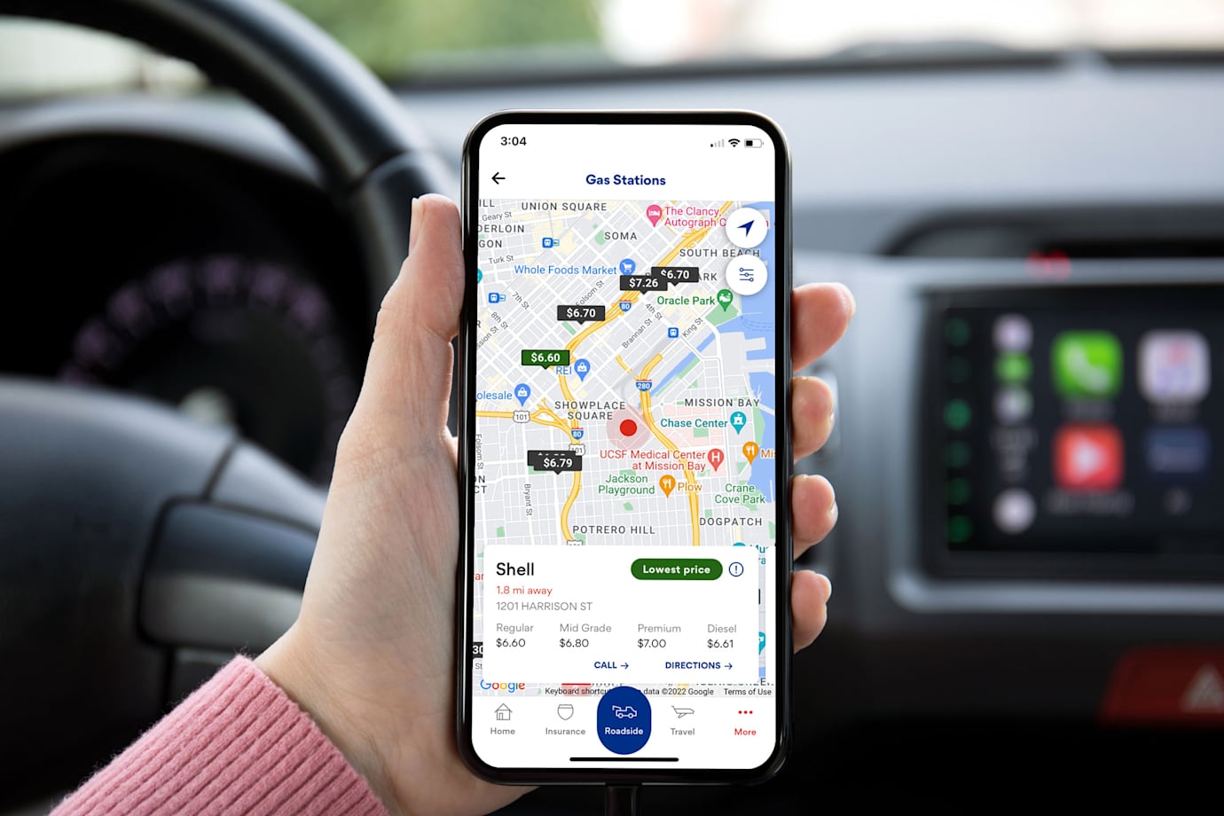 A driver looks for the cheapest nearby gas on the AAA Mobile App.