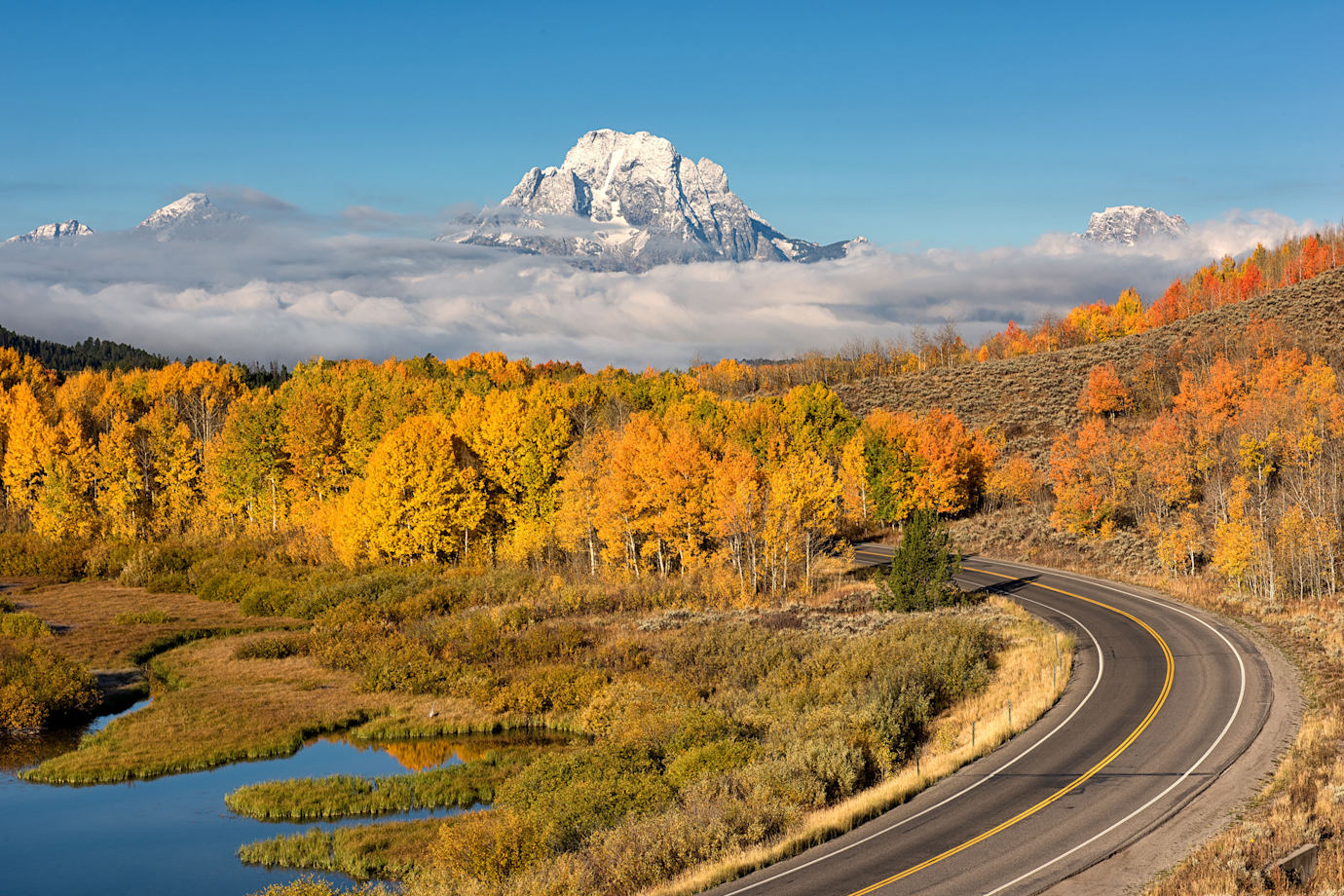 Mt. Moran overlooks a winding road in Wyoming's Teton National Park.