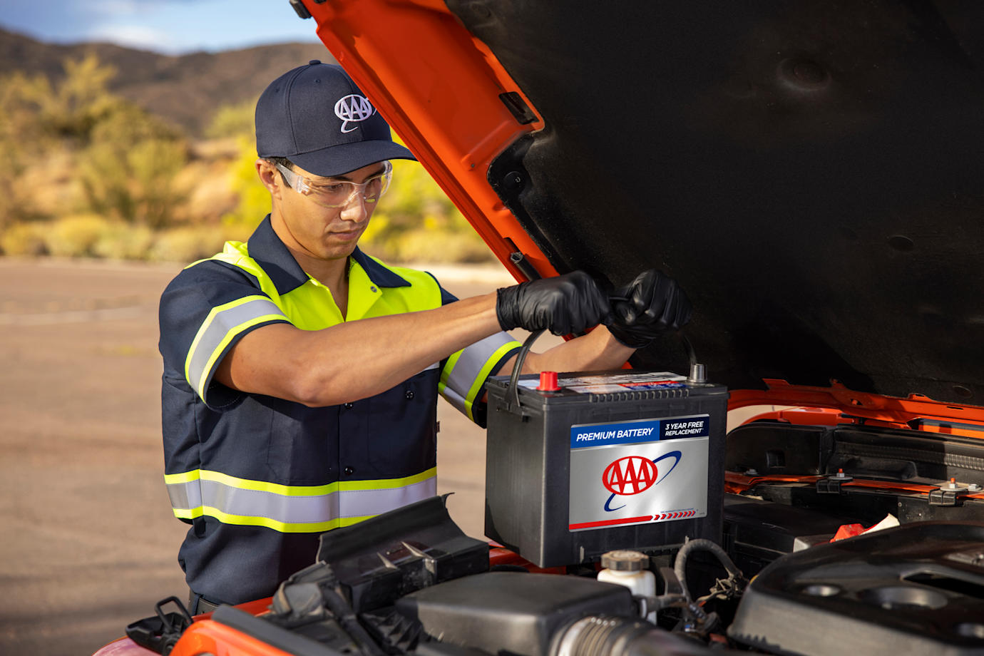 AAA roadside technician replaces an old battery with a AAA battery