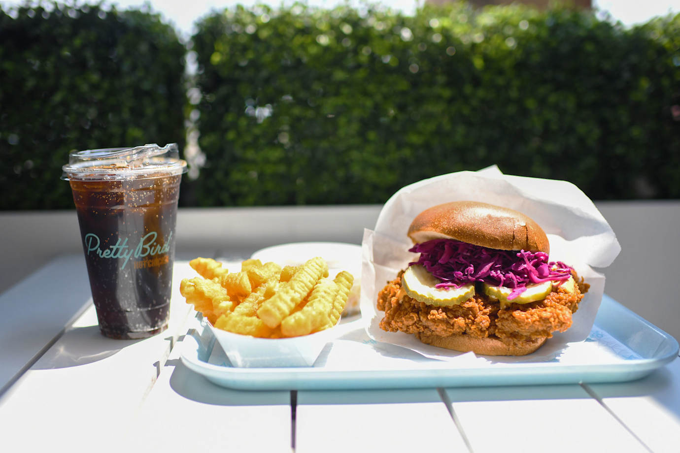 Fried chicken sando combo outside at Pretty Bird in Salt Lake City.