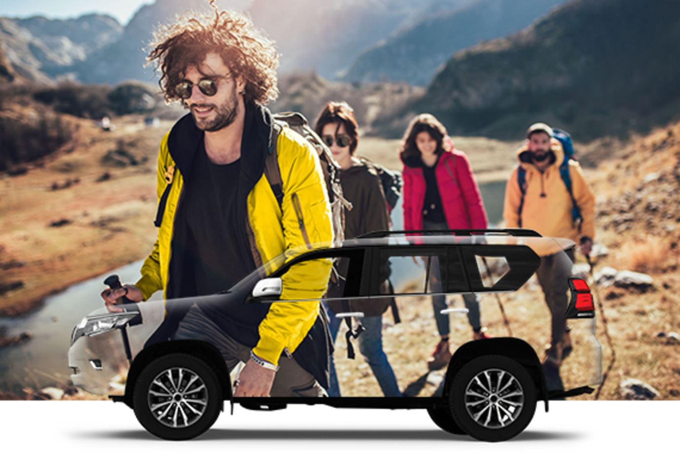 group hiking by a Hertz rental car booked through AAA