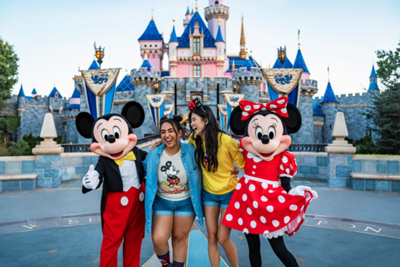 see a statue of walt disney and mickey mouse at disneyland on a disney vacation