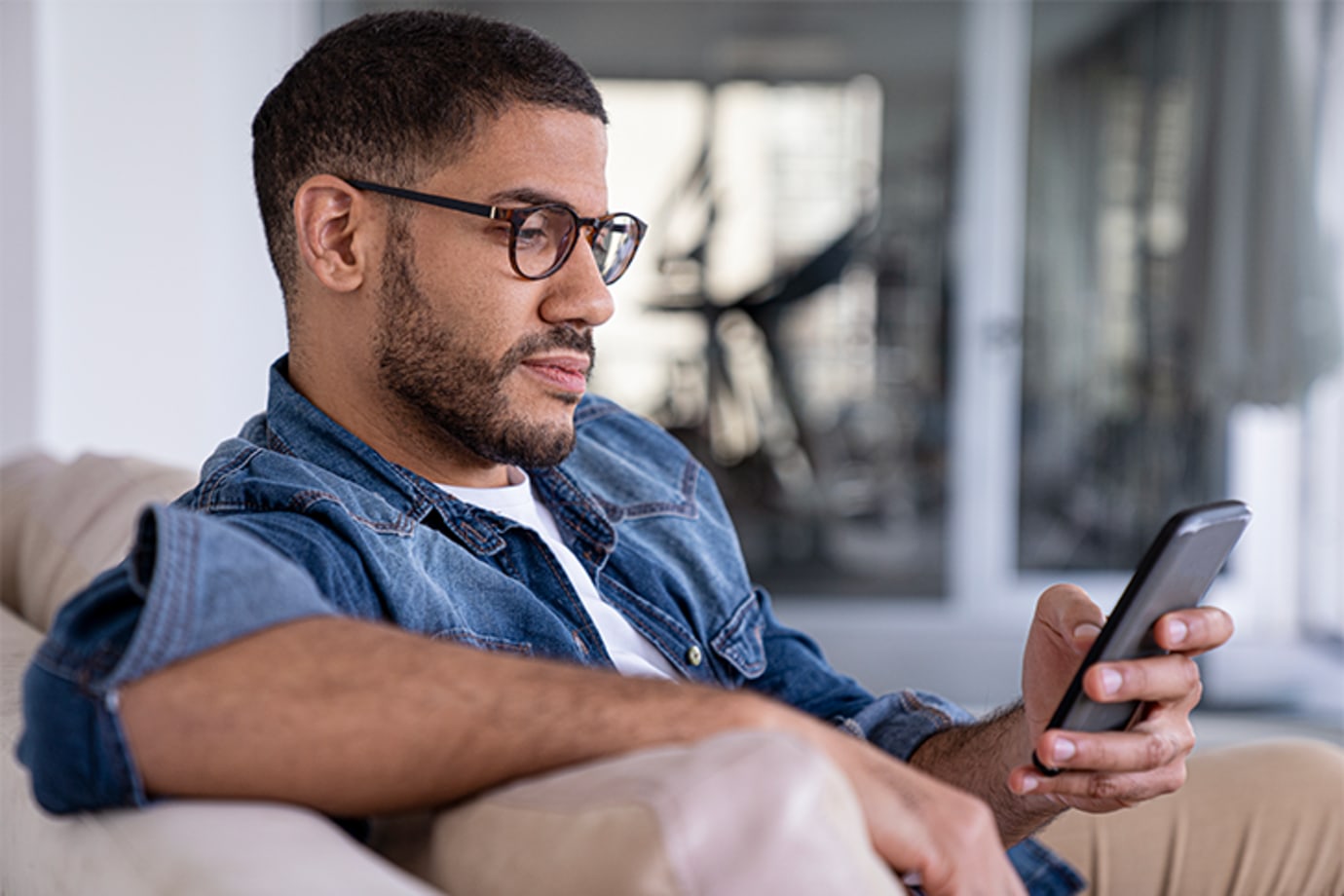 A man with PMID uses technology at home