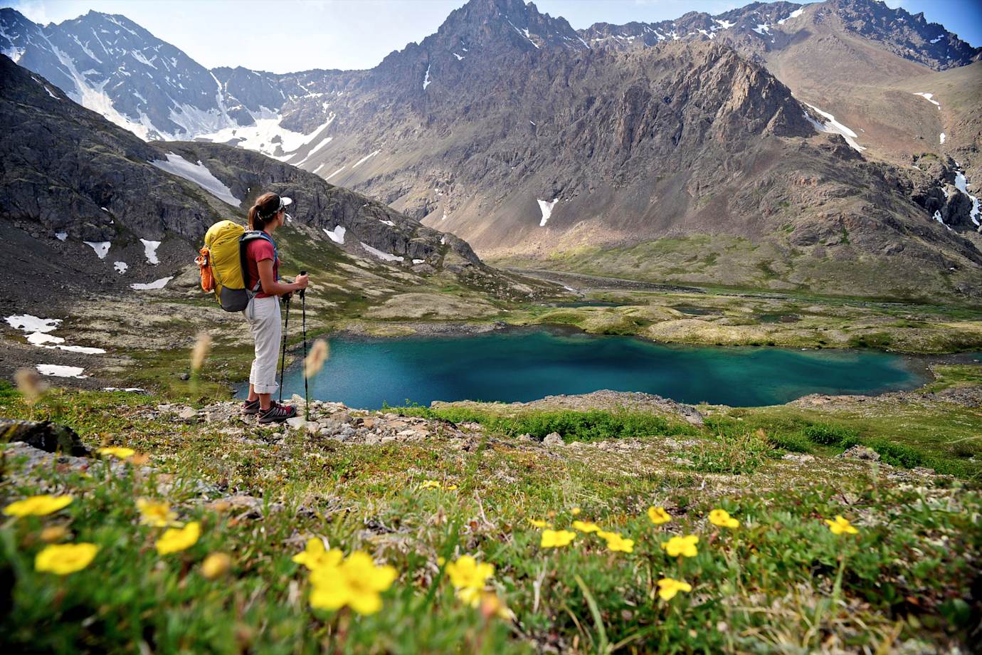 A hiker overlooks Williwaw Lakes in Chugach State Park, near Anchorage, Alaska, in summer.