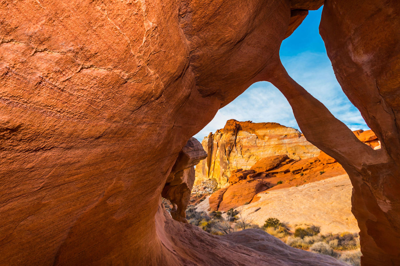 Fire Cave Arch with the White Domes in the distance in Nevada's Valley of Fire State Park.