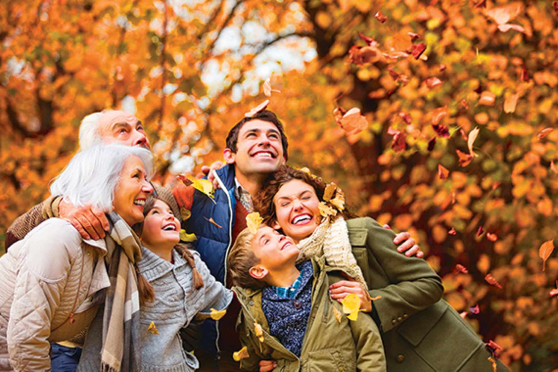 Family hiking in Autumnal forest
