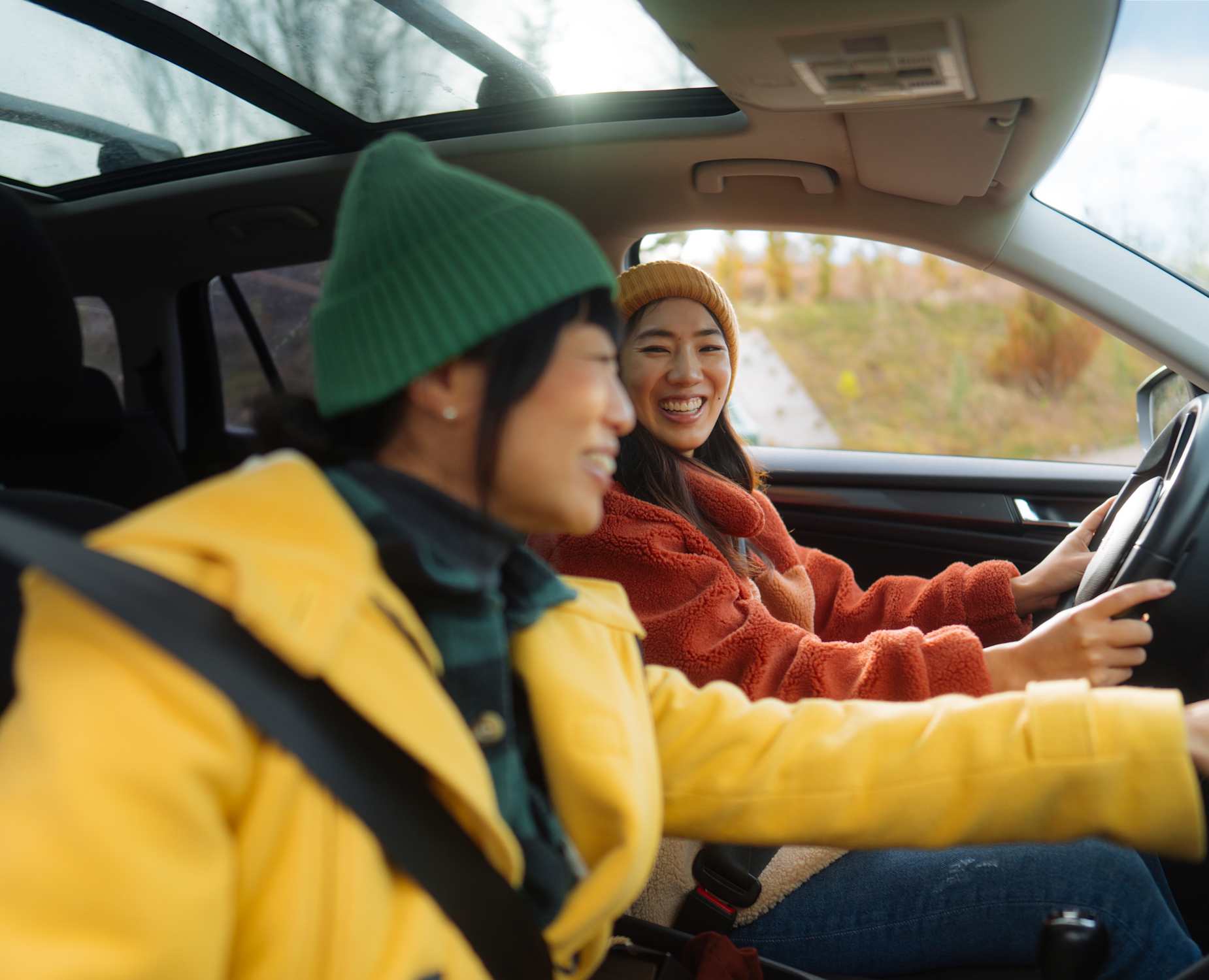 Man and woman in car driving