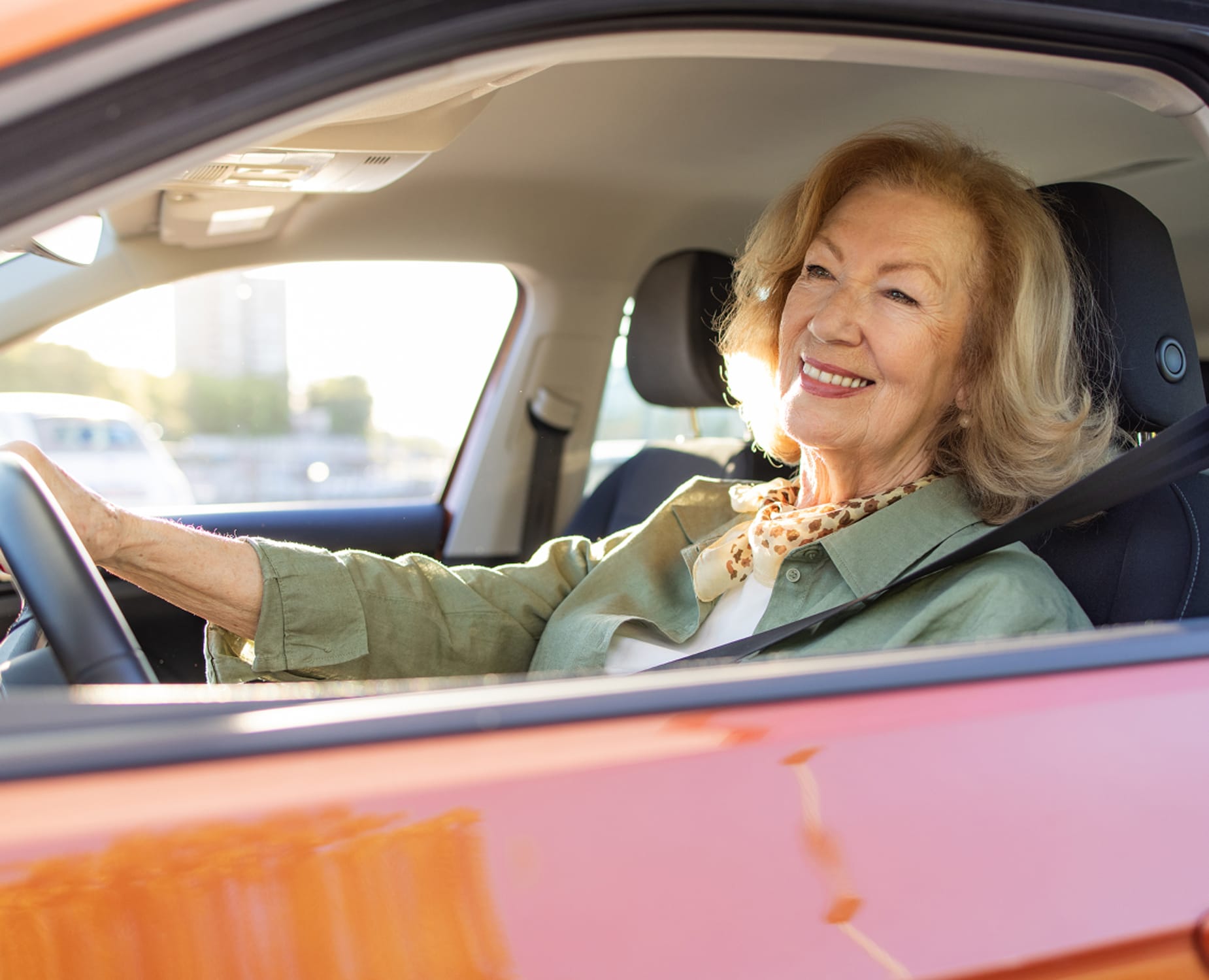 a driver looks confident driving their new car thanks to the AAA Car Buying program