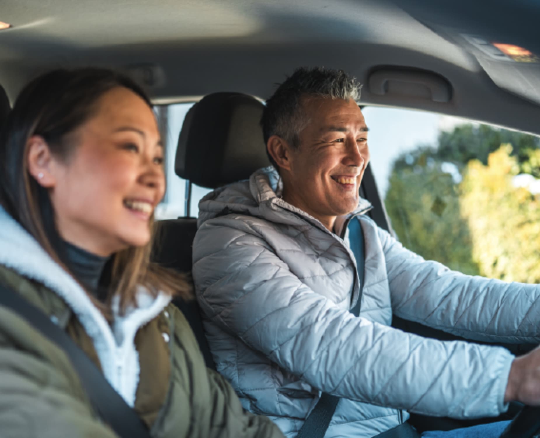Man and woman in car driving