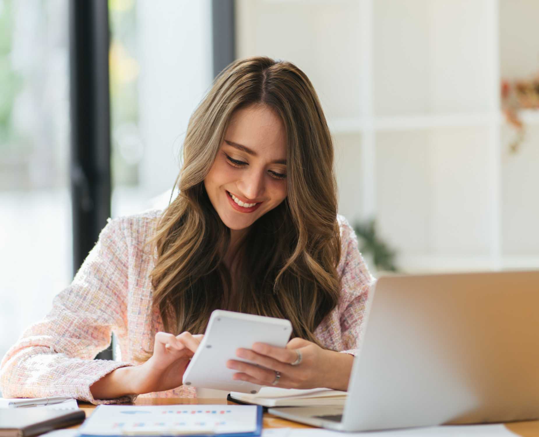 Woman looking peaceful and confident doing her taxes.