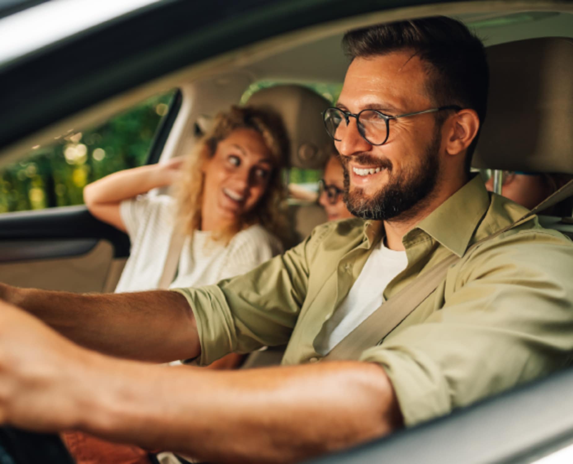 A dad drives his family on a road trip