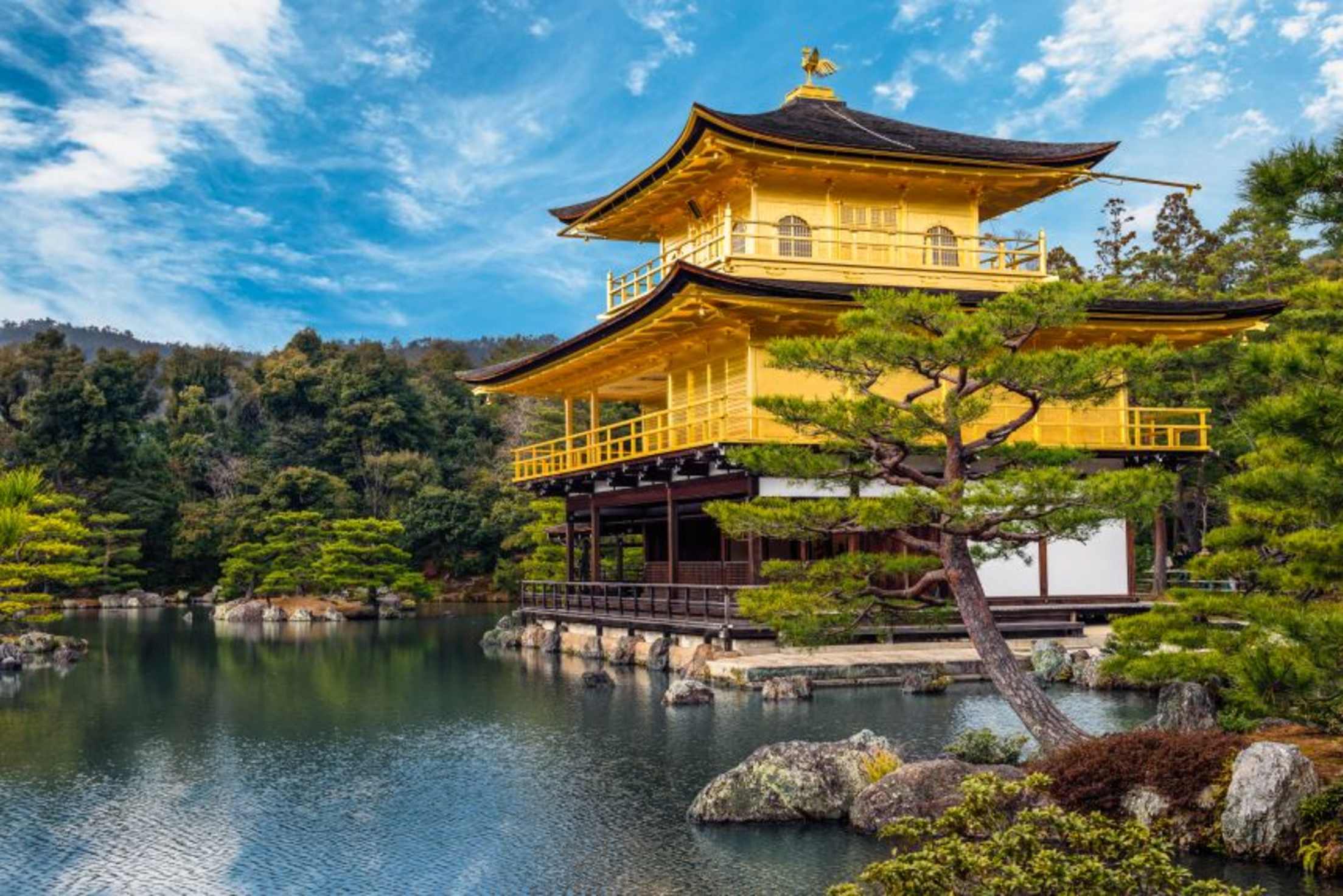 Golden Pavilion, Kinkaku-ji, of Kyoto, Japan gold leaf shimmers in the sun across the pond, image