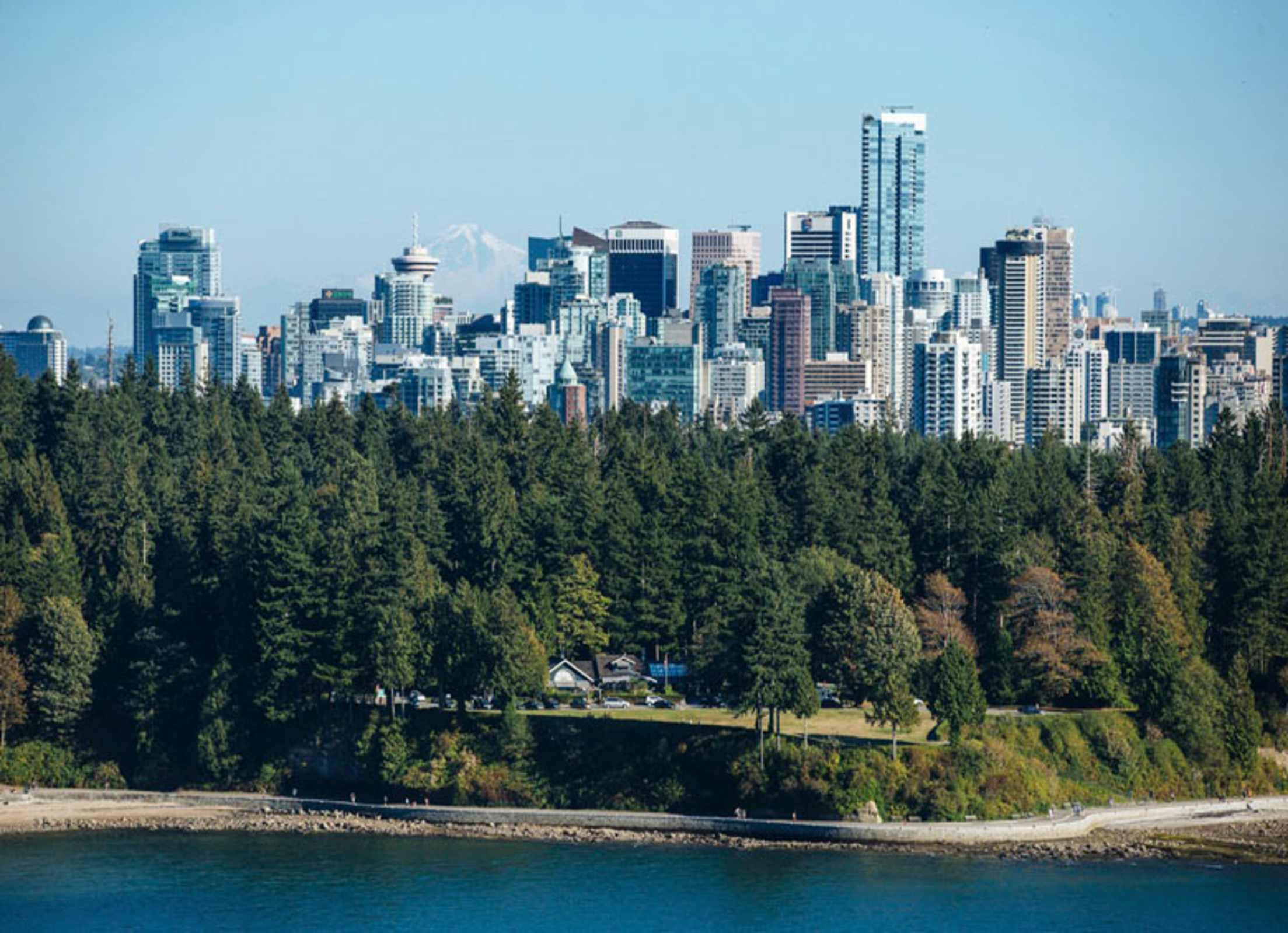 Teahouse at water's edge in Stanley Park with Vancouver, B.C., skyline in background picture