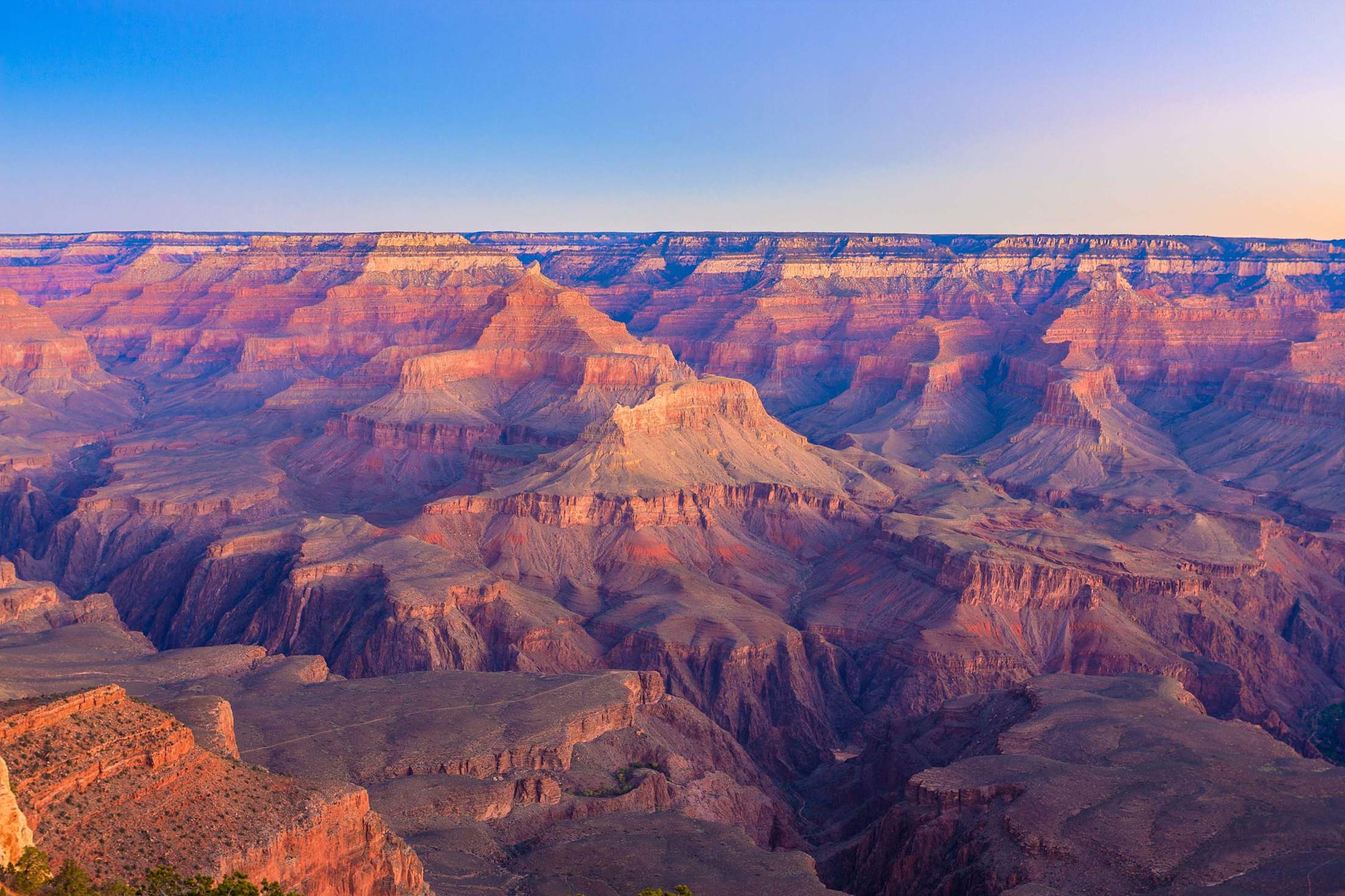 Grand Canyon bluffs glowing red and yellow, picture