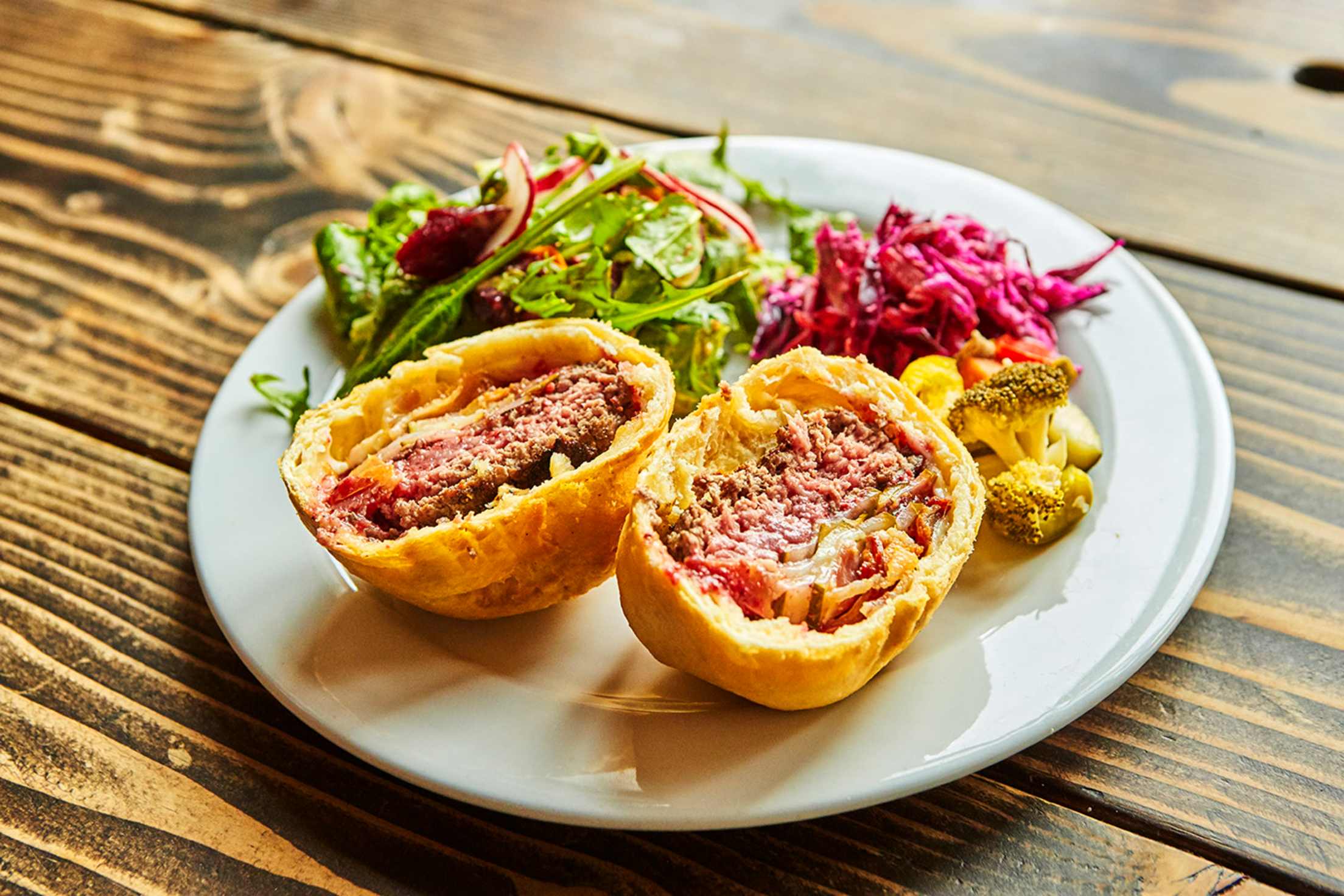 deep fried beef burger wrap with salad and veggie sides at Korzo in Sunset Park, Brooklyn picture