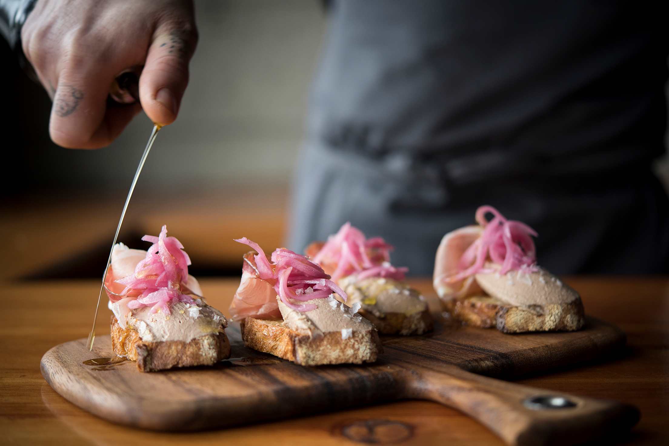 bruschetta with chicken liver, shallots, and speck drizzled with oil at Tavolàta in Seattle, Washington, picture