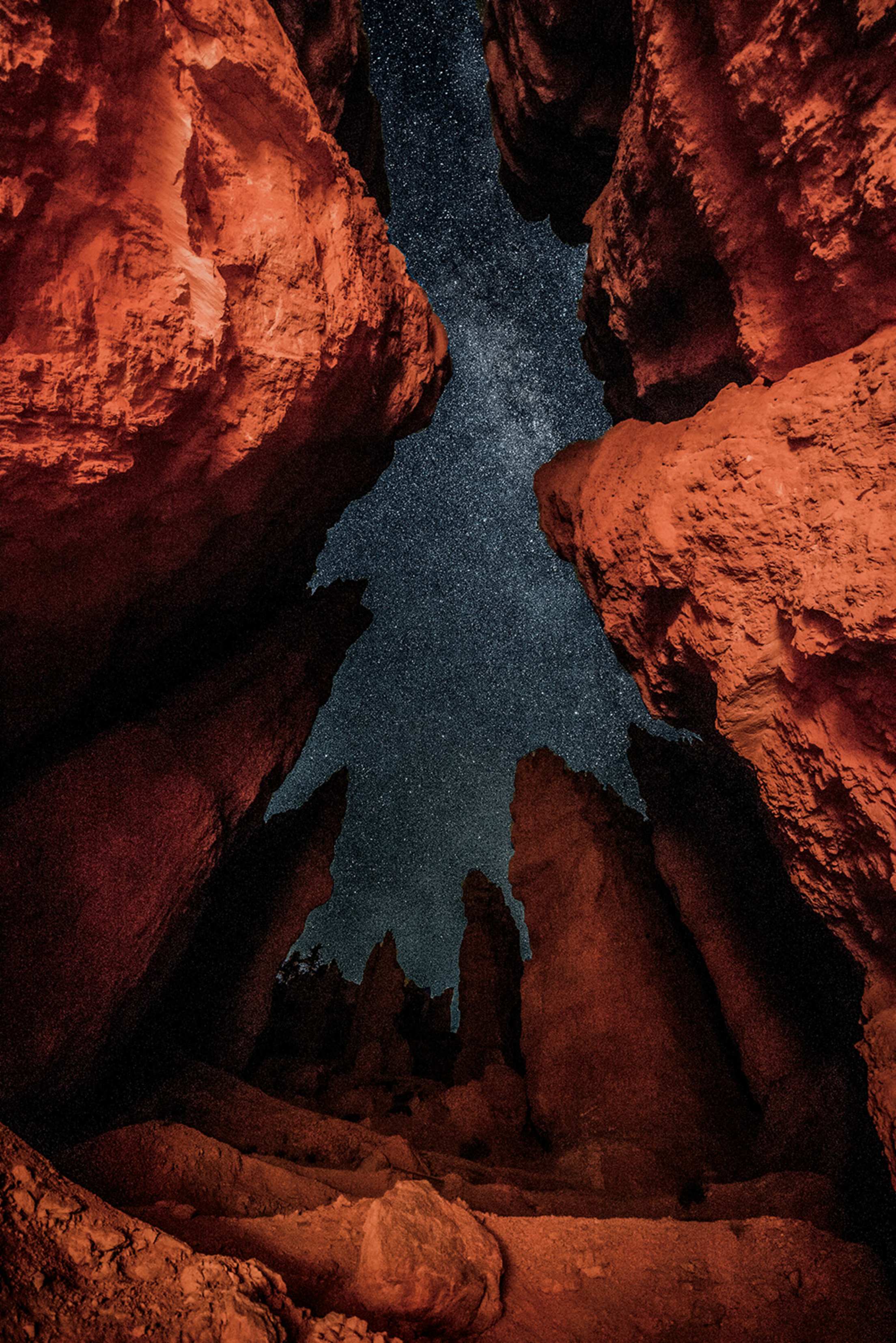 view of the Milky Way at night looking up through sandstone spires – aka hoodoo – at Bryce Canyon National Park in southern Utah, picture