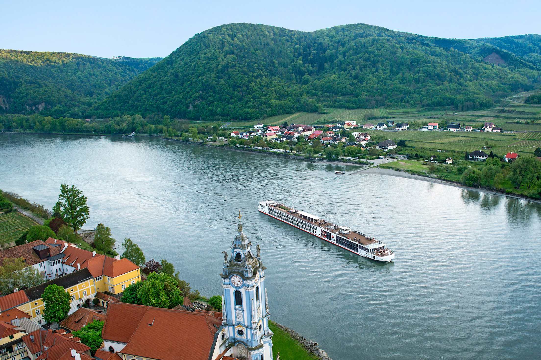 A Viking Longship glides past Dürnstein, Austria.