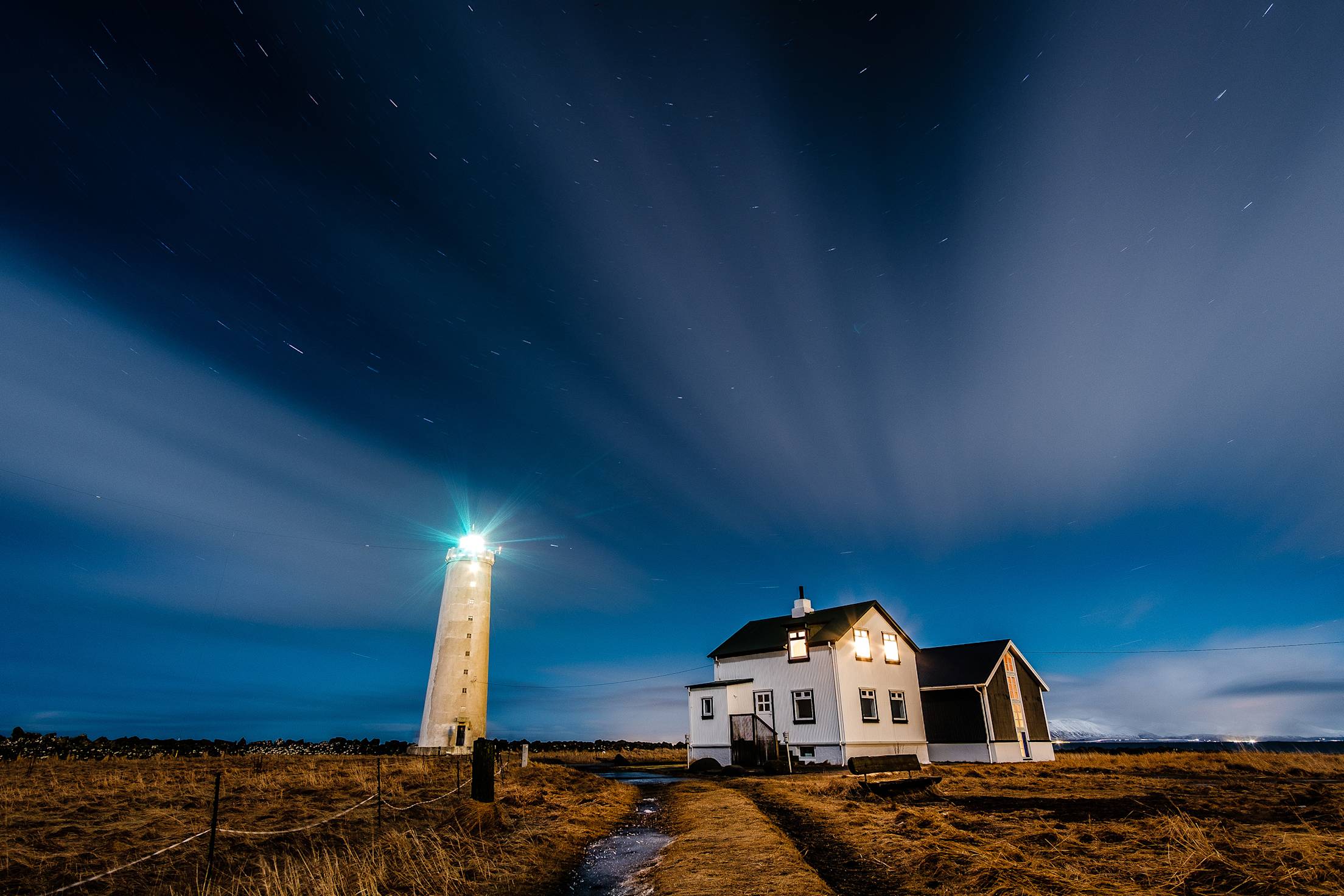 Northern lights over the Grotta Island Lighthouse outside of Reykjavik.
