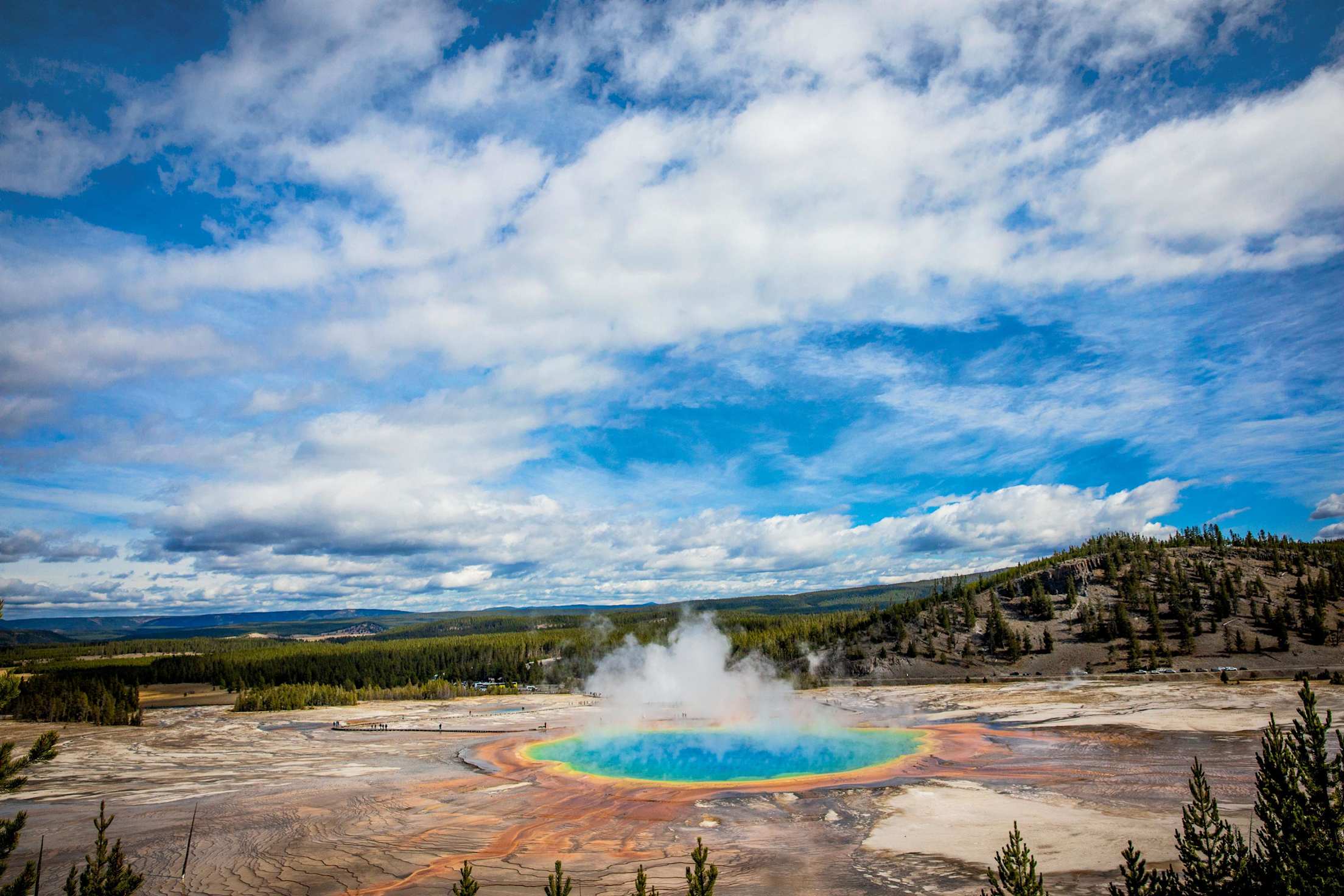 caldera known as Grand Prismatic Spring glows with a brillant rainbow of color at Yellowstone National Park in Wyoming