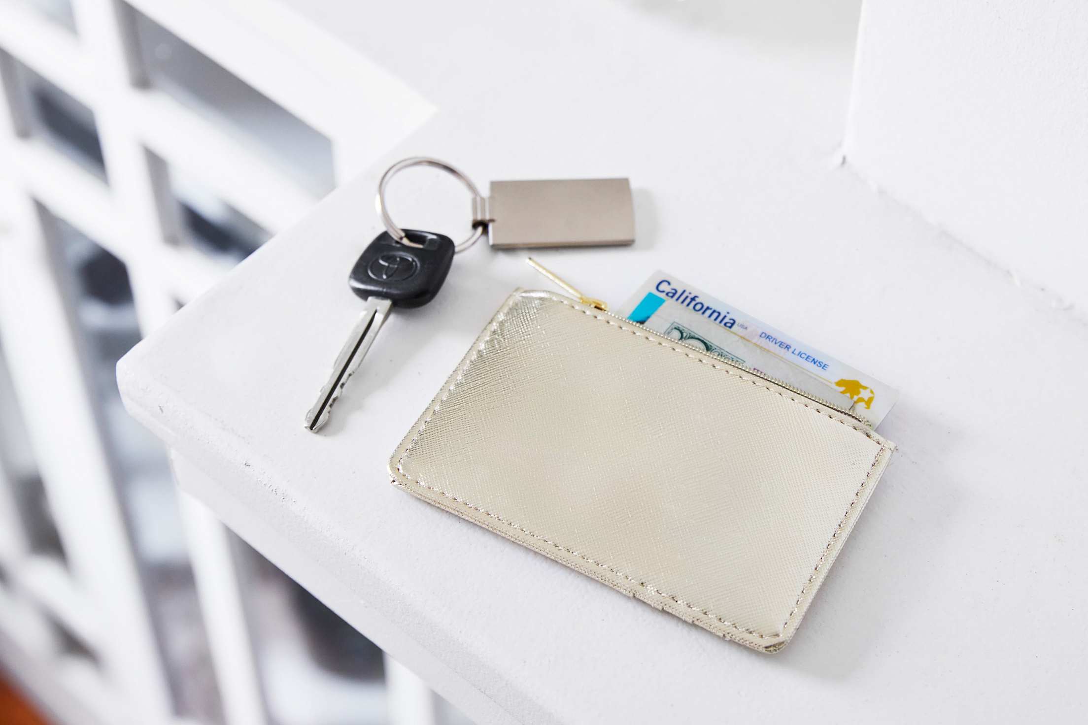 California driver's license in a wallet on a shelf.