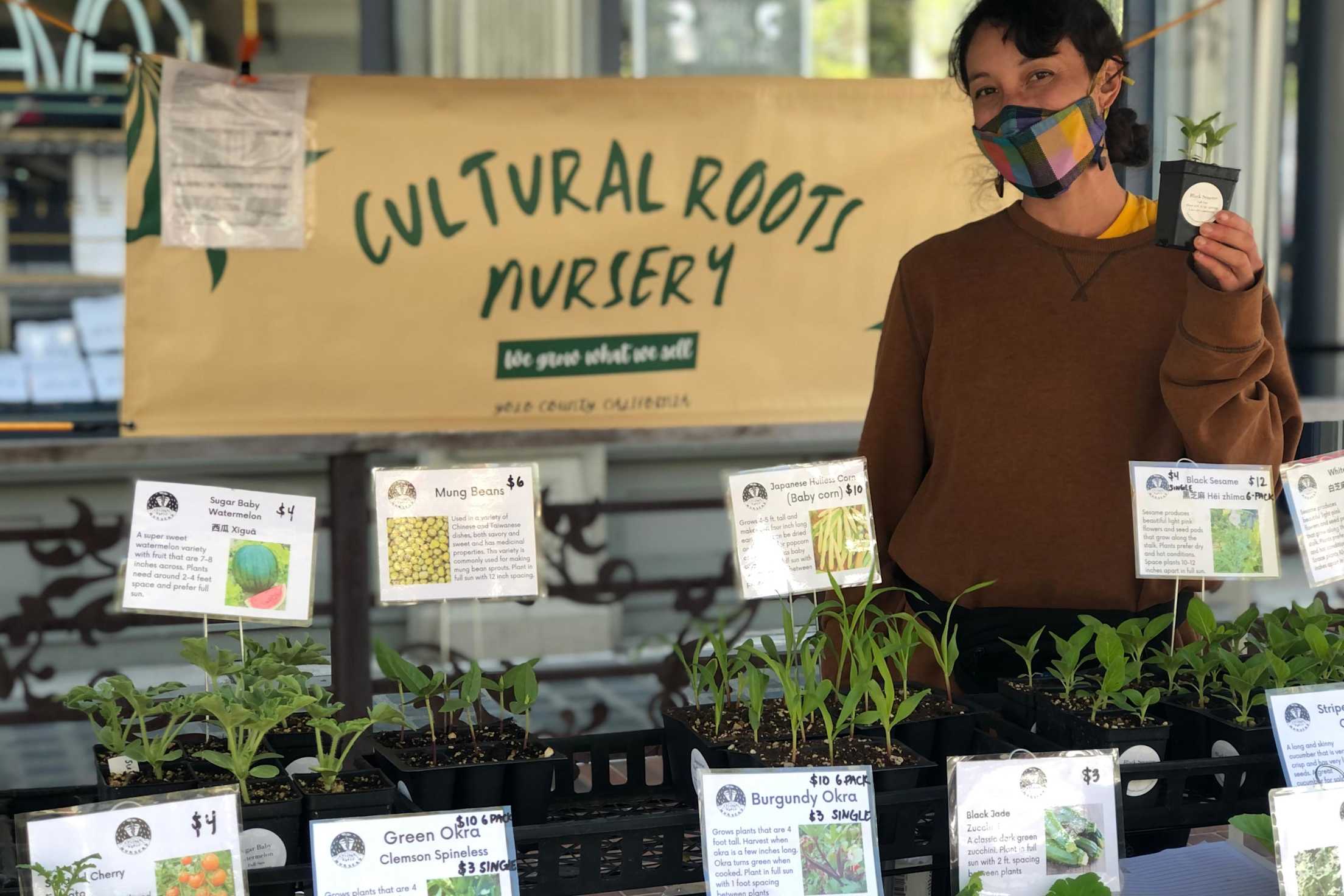 A vendor from Cultural Roots Nursery at Old Oakland Farmers Market.
