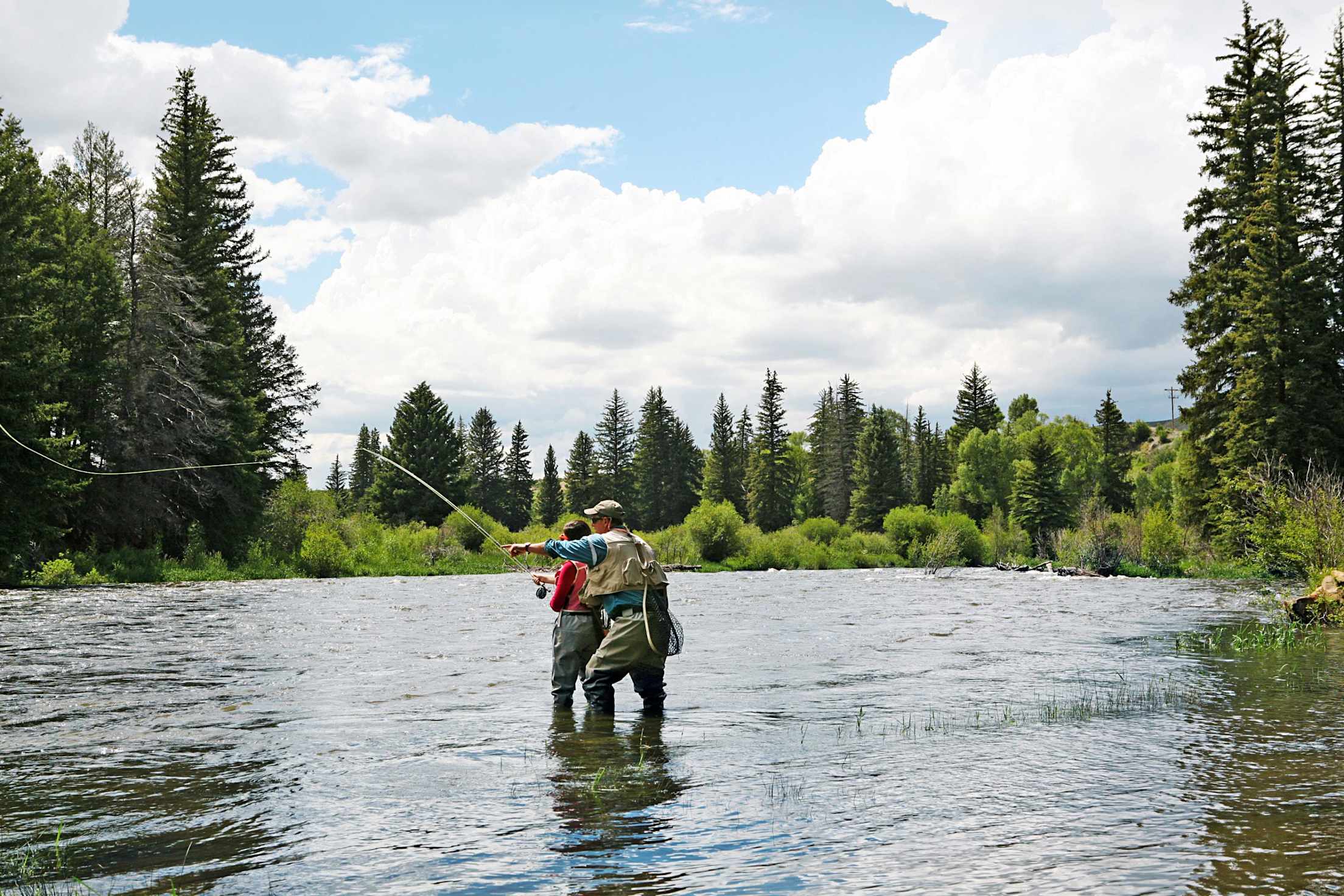 Guests flyfish with a guide from Drowsy Water Ranch.