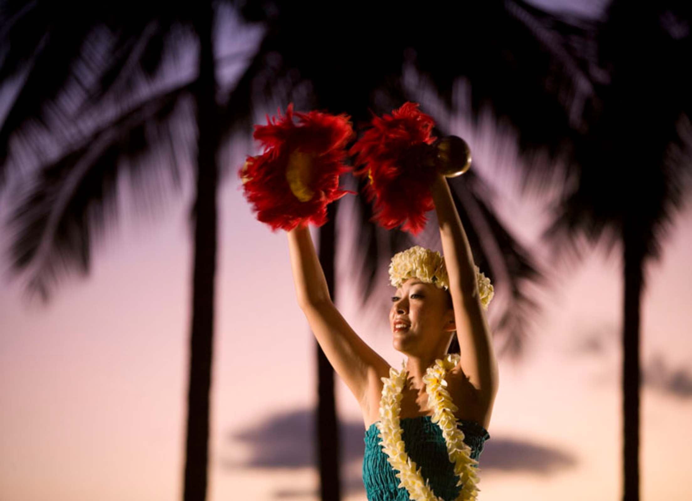 hula dancer performs at sunset on Kuhio Beach in Honolulu, Hawaii, picture
