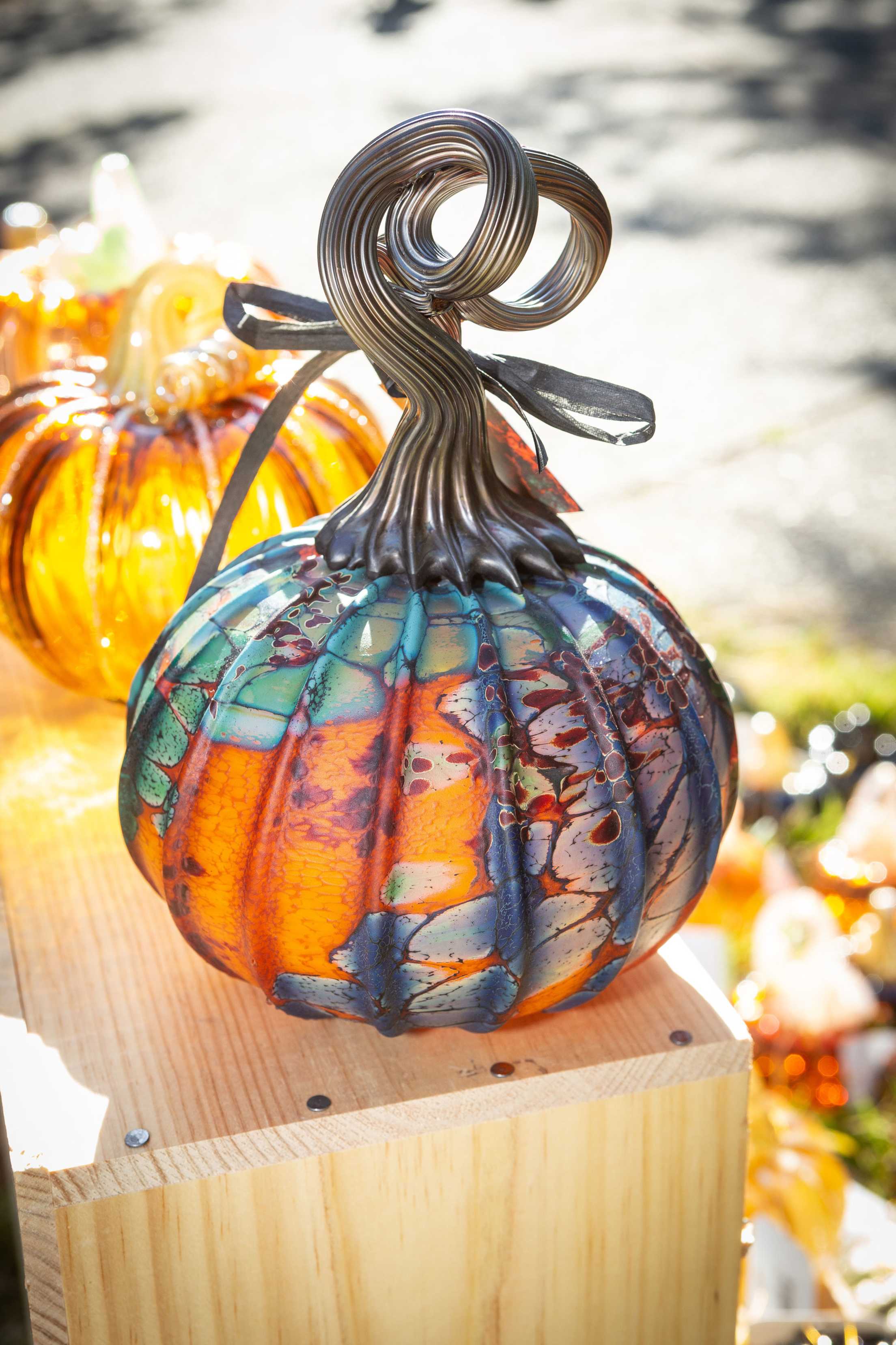 An orange glass pumpkin on display at the Palo Alto Art Center's Great Glass Pumpkin Patch in Palo Alto, California.