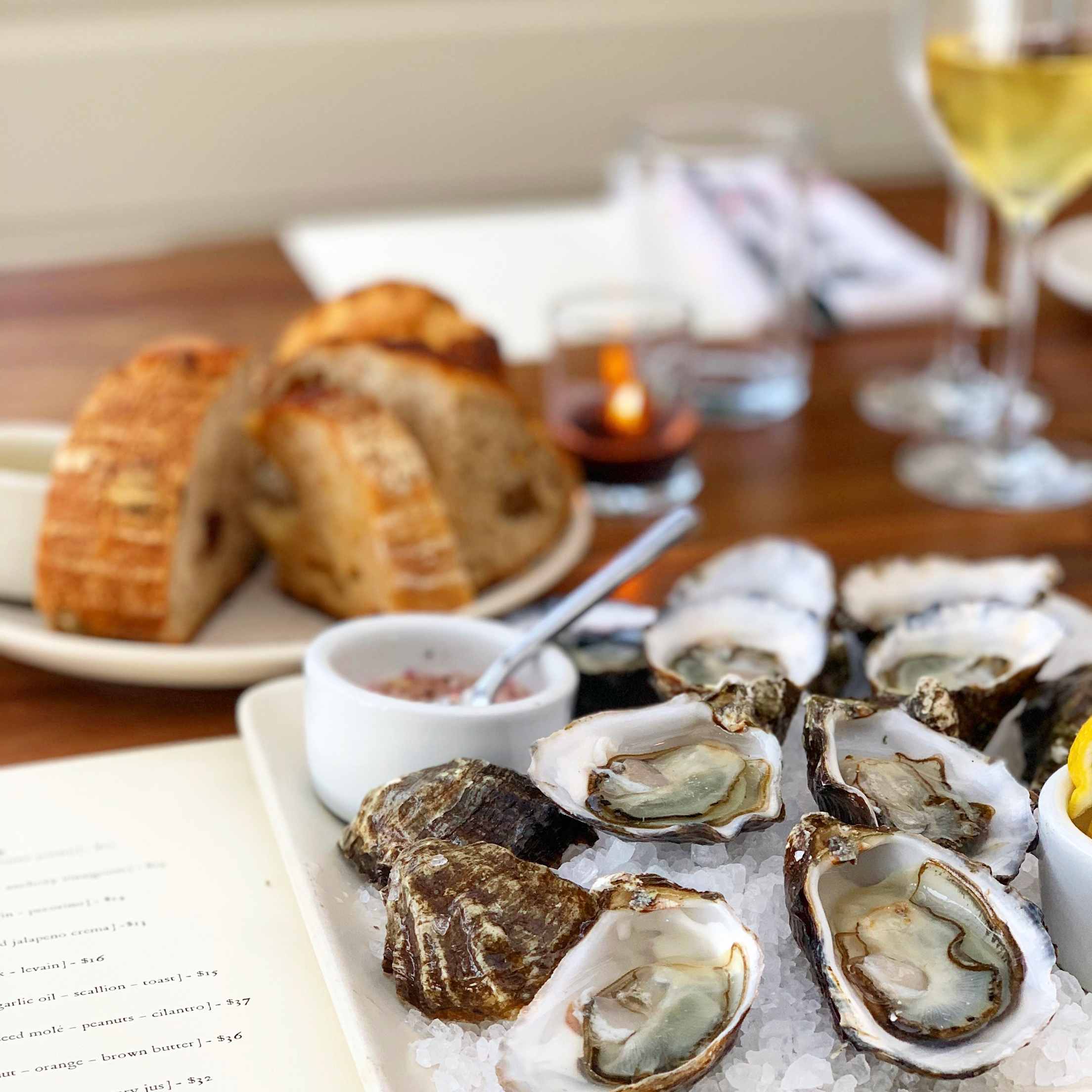 Fresh oysters on salt rocks at the Saltwater Oyster Depot near Tomales Bay, California.