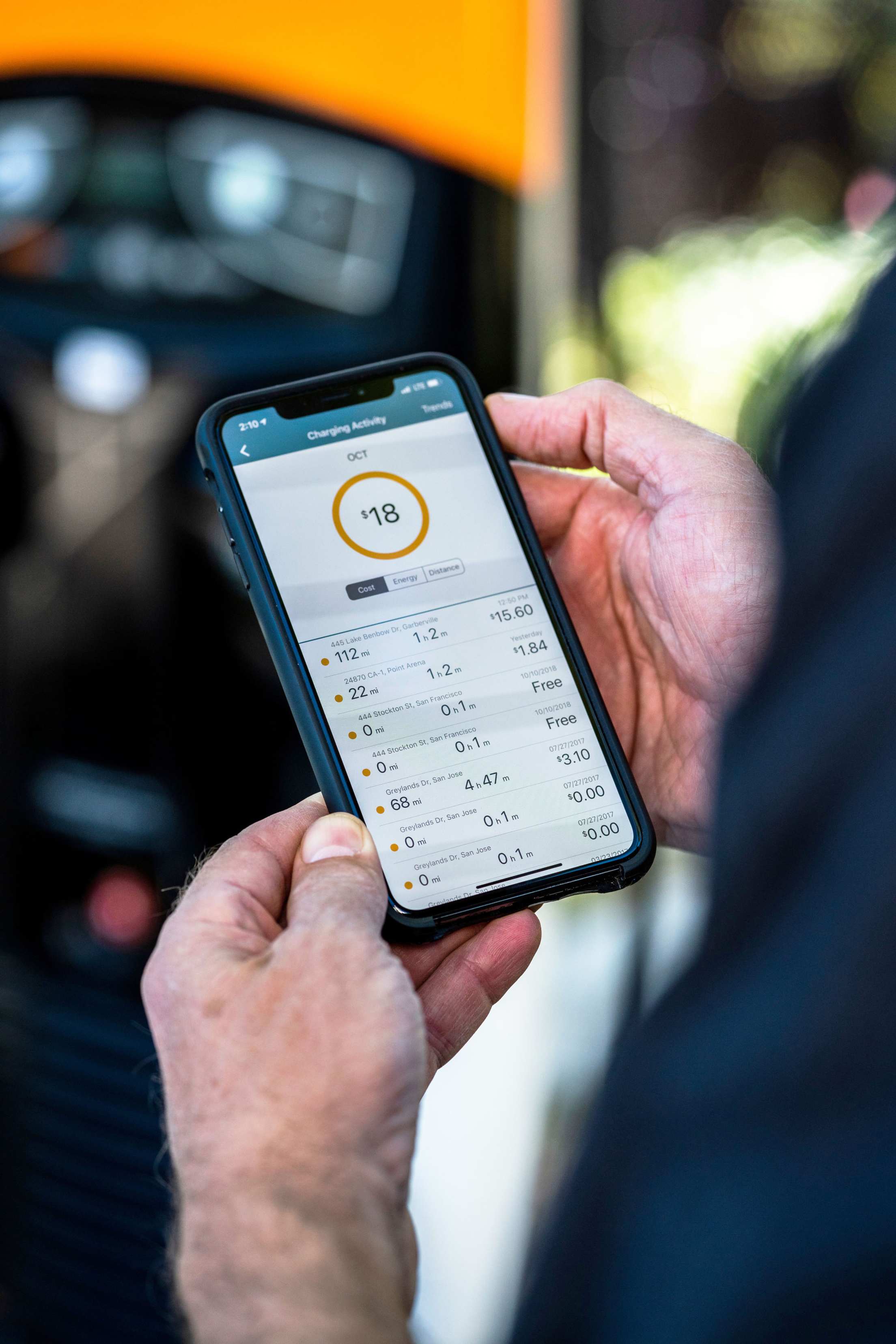 An EV driver ads up their total cost to charge on a road trip.