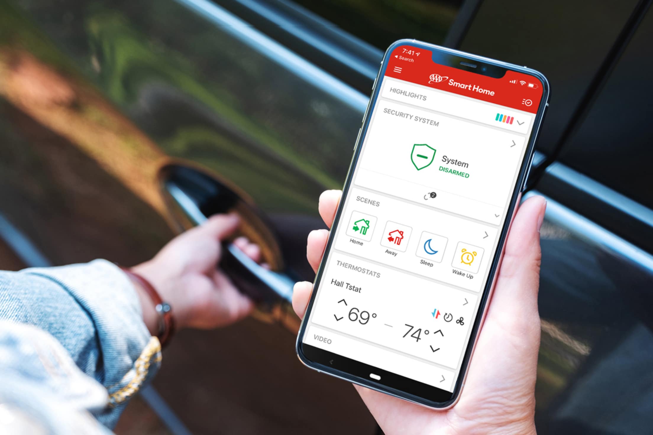 AAA Member checks on their home security system from their phone.
