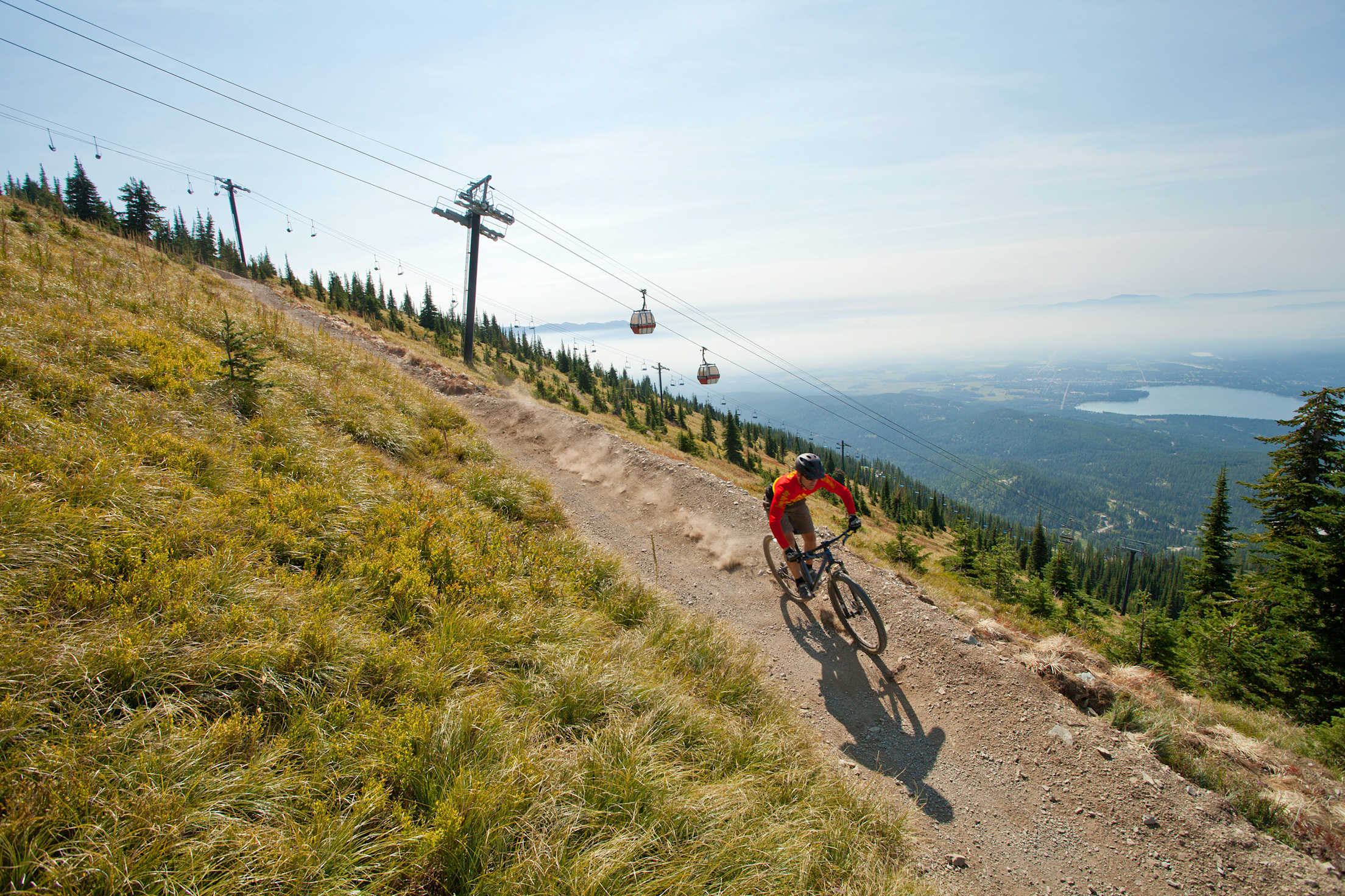 A mountain biker takes the Summit Trail at Whitefish Mountain Resort.