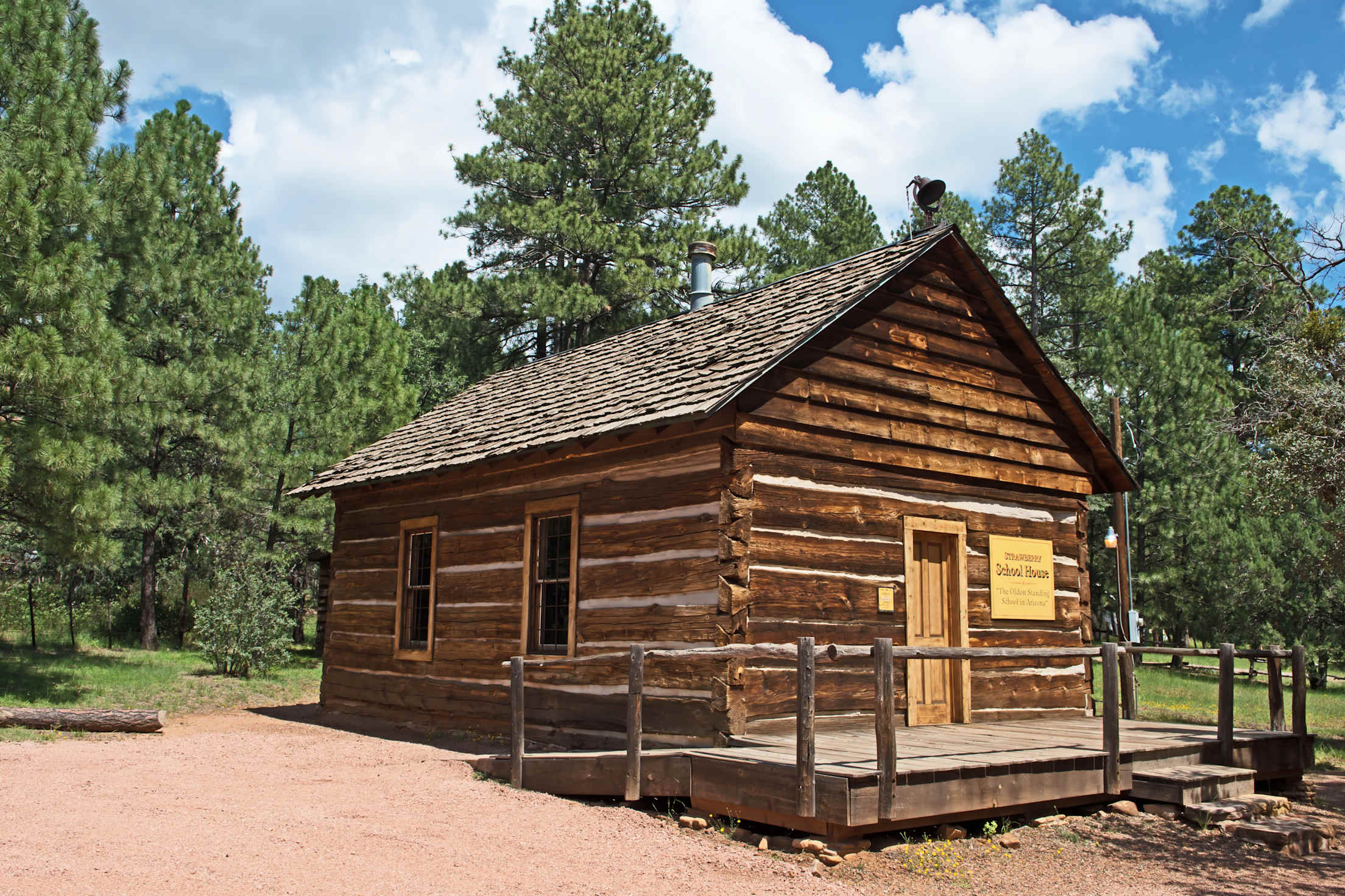 Arizona's oldest schoolhouse in Strawberry, Arizona on a partly cloudy summer day.