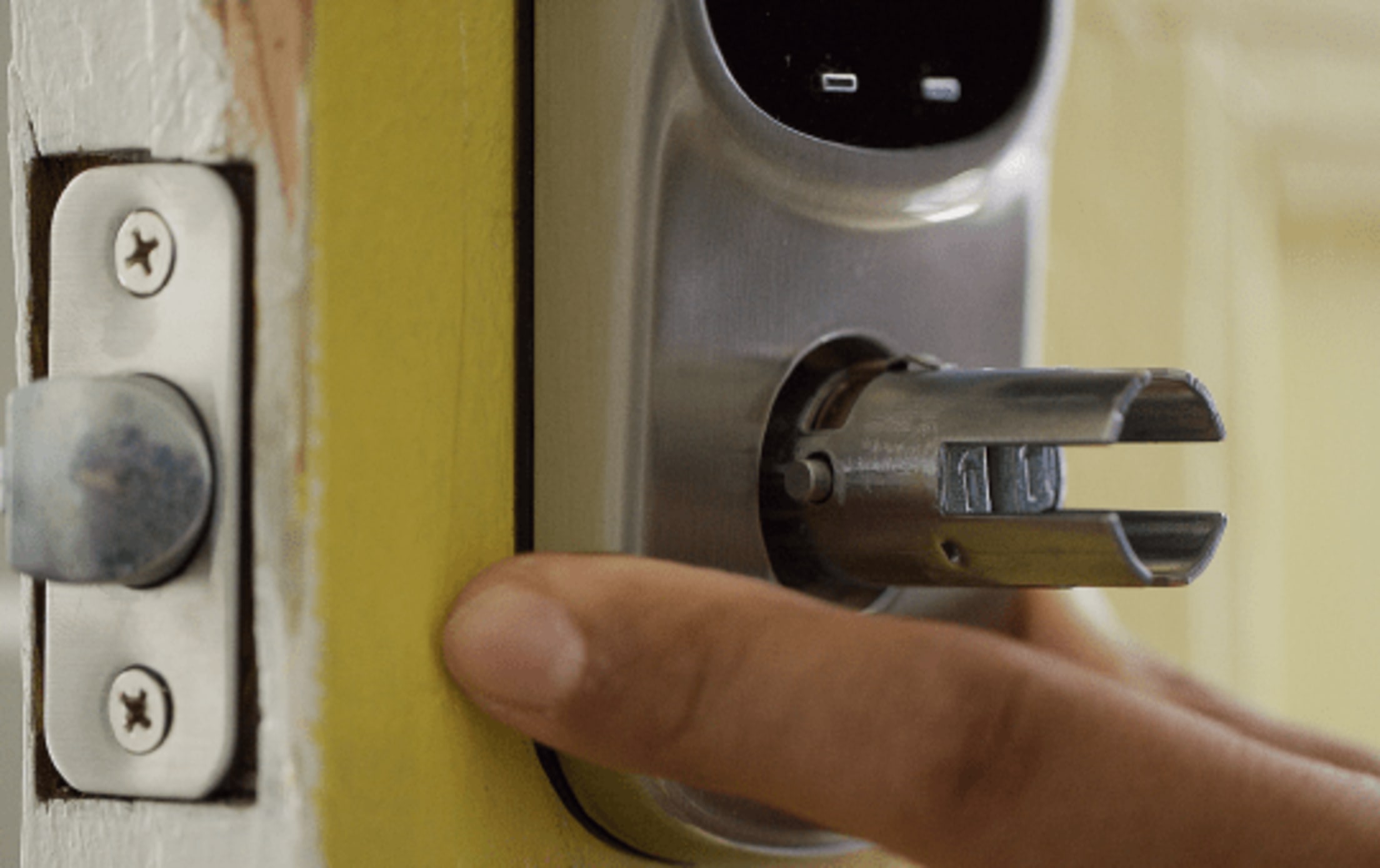 The keypad is flush against the door.