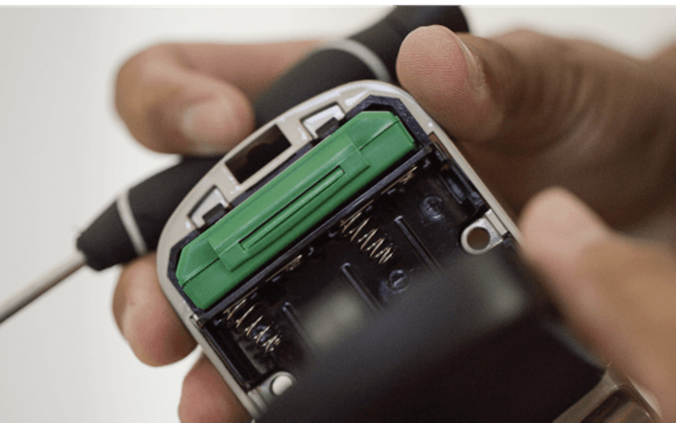 Remove the battery cover from your interior lock